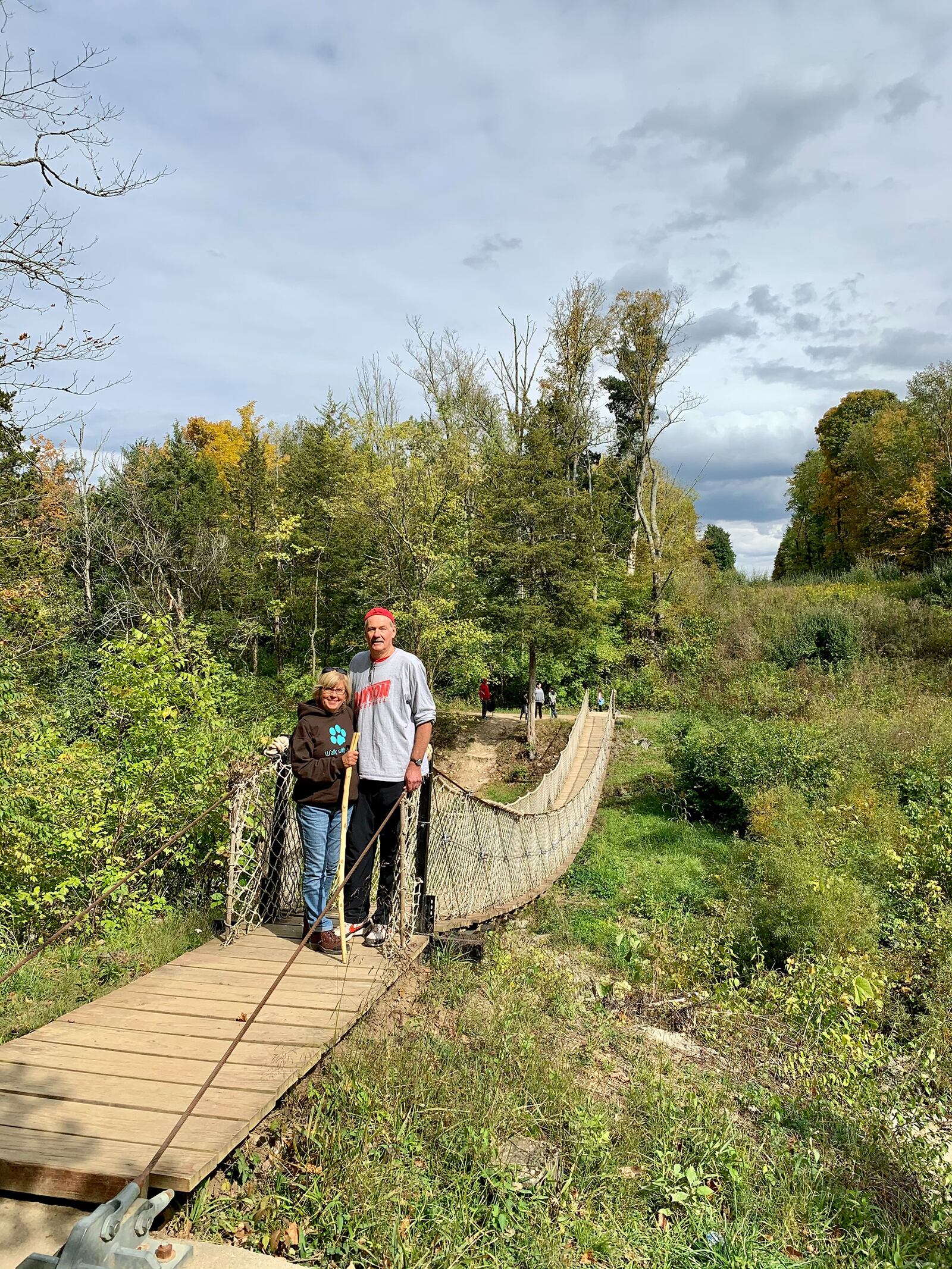 Barb (L) and Steve Hess at Caesar Creek State Park near Waynesville. One of Barb's former students made the walking stick she uses during their hikes.