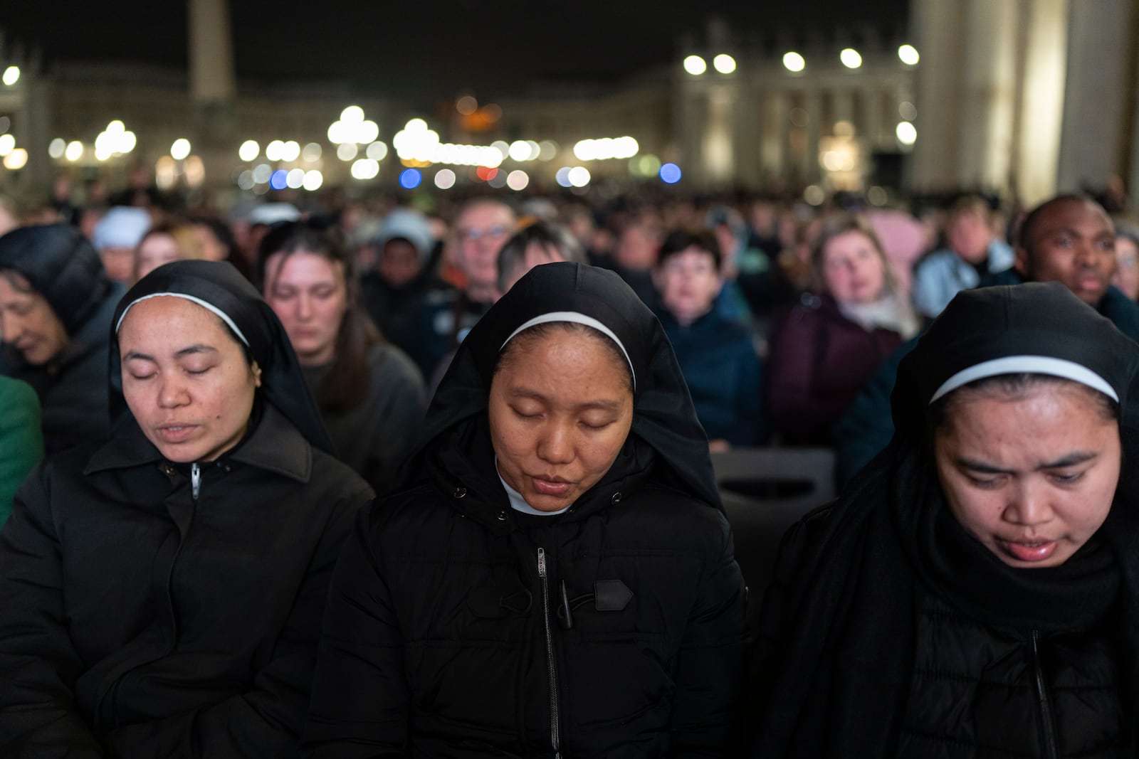 Catholic faithful attend a nightly rosary prayer service for the health of Pope Francis in St. Peter's Square at the Vatican. (AP Photo/Mosa'ab Elshamy)