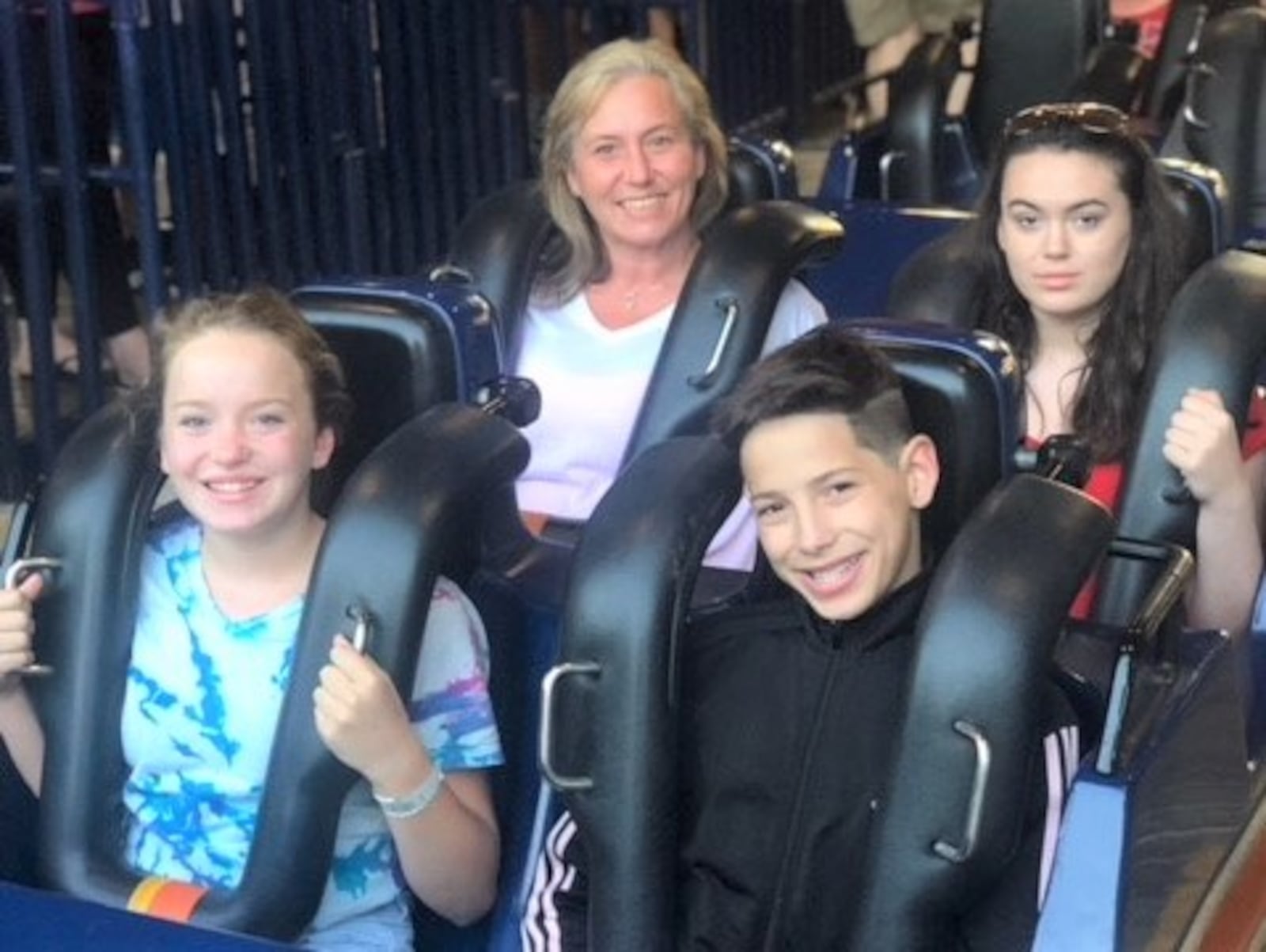 Melissa Rodgers (back left) and three of her children on a recent trip to Kings Island. “This was the first time in many years that we were able to get out and do fun things without my addiction getting in the way,” she said. CONTRIBUTED