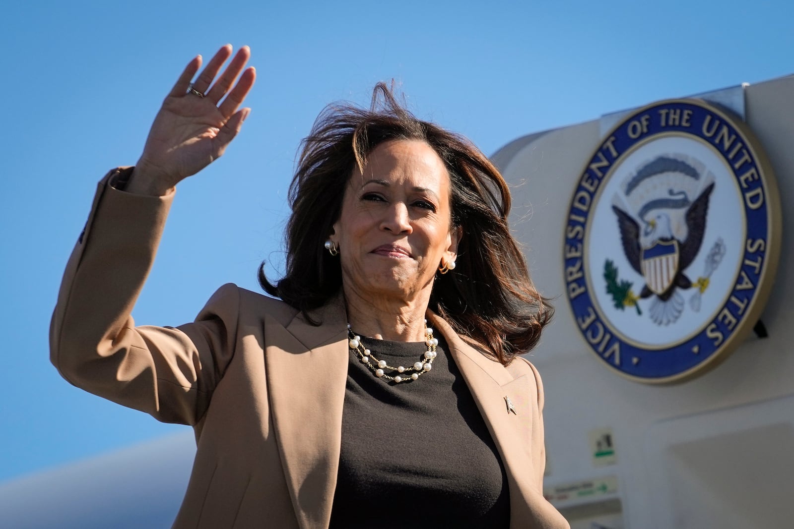 Democratic presidential nominee Vice President Kamala Harris Vice waves as she boards Air Force Two at Philadelphia International Airport in Philadelphia, Thursday, Oct. 24, 2024, en route to Atlanta. (AP Photo/Matt Rourke)