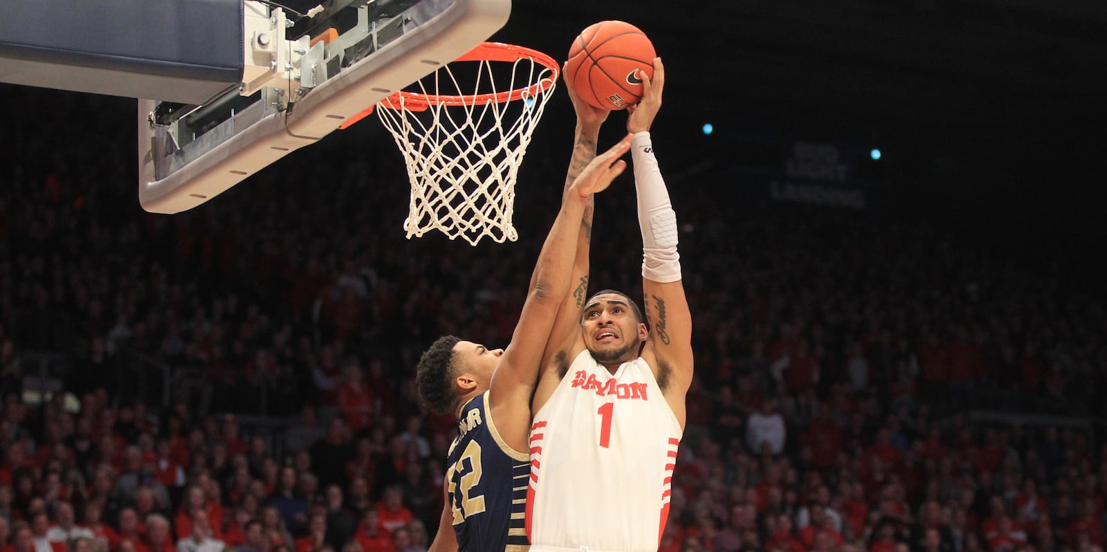 Dayton's Obi Toppin dunks against George Washington on Saturday, March 7, 2020, at UD Arena.