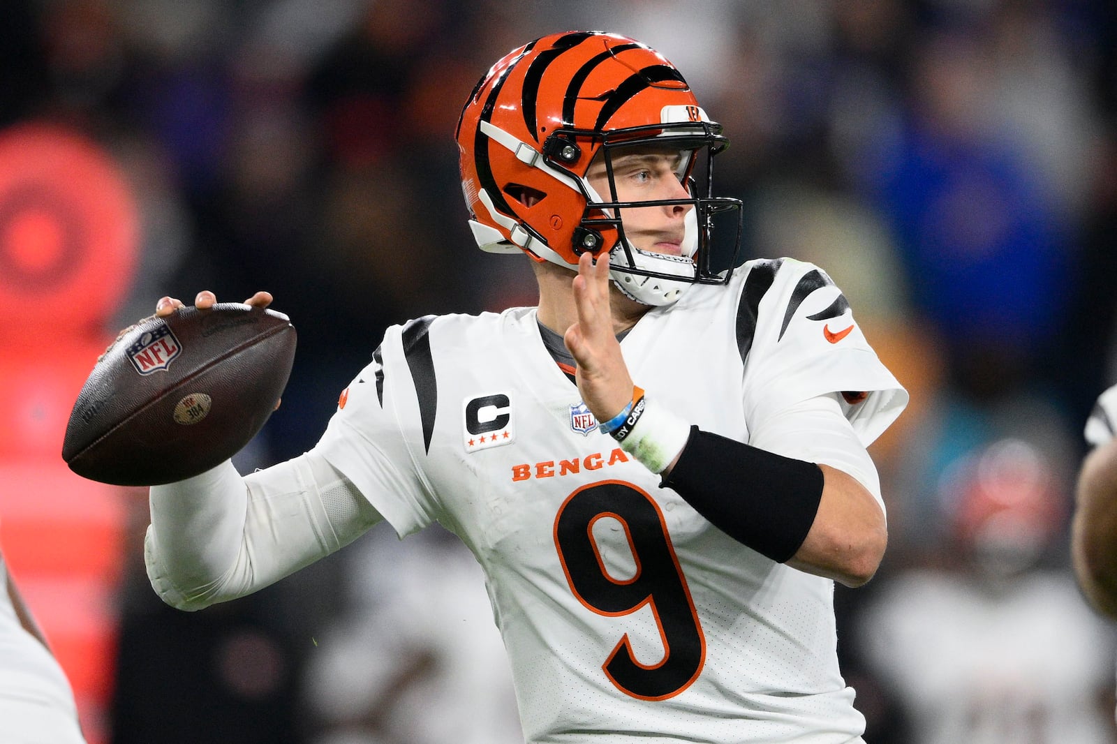 Cincinnati Bengals quarterback Joe Burrow (9) looks to pass in the first half of an NFL football game against the Baltimore Ravens in Baltimore, Thursday, Nov. 16, 2023. (AP Photo/Nick Wass)