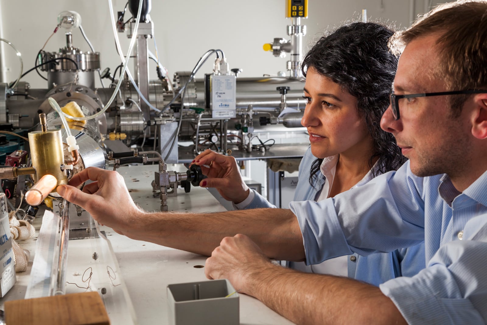 Dr. Nicholas Shuman and Jenny Sanchez conduct an experiment in the plasma chemistry lab at Kirtland Air Force Base, New Mexico. The facility, part of the Air Force Research Laboratory's Space Vehicles Directorate, helps scientists understand how the space environment affects spacecraft in orbit. CONTRIBUTED PHOTO