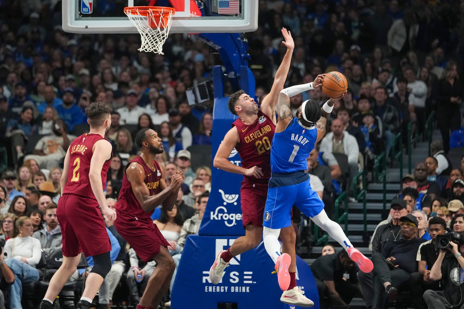 Dallas Mavericks guard Jaden Hardy (1) goes up for a basket against Cleveland Cavaliers forward Georges Niang during the first half of an NBA basketball game, Friday, Jan. 3, 2025, in Dallas. (AP Photo/Julio Cortez)