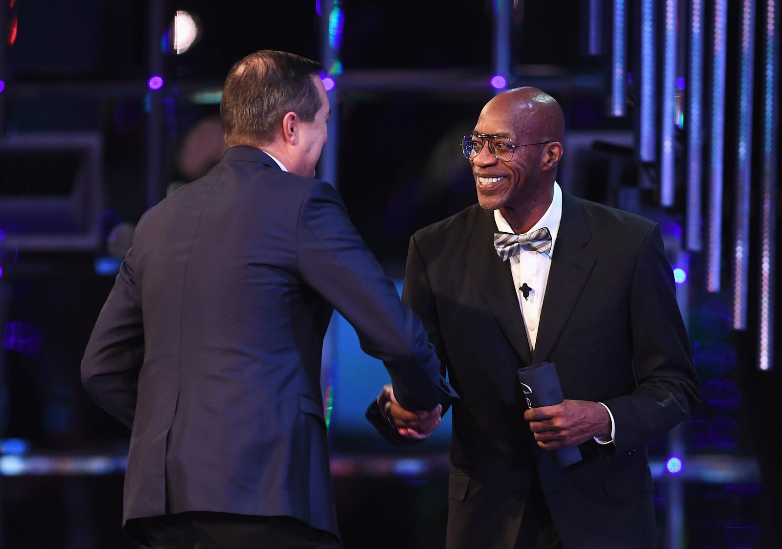 Laureus Academy chairman Edwin Moses shakes hands with Chairman and owner of the Chicago Cubs Tom Ricketts while he accepts the Laureus World Team of the Year Award during the 2017 Laureus World Sports Awards on February 14, 2017 in Monaco, Monaco.