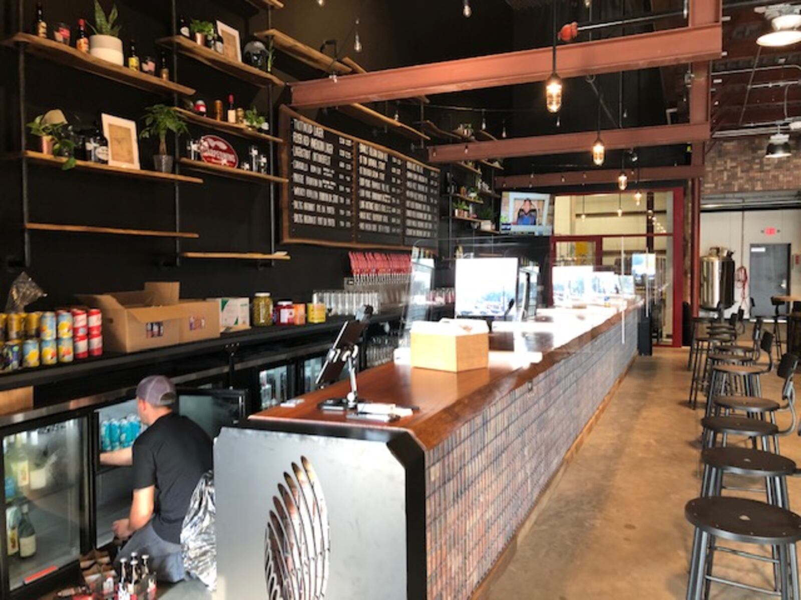 Dayton-based Warped Wing Brewing Co. will open its ambitious new second location, The Warped Wing Barrel Room & Smokery, to the public on Saturday, Aug. 29, in Springboro. MARK FISHER/STAFF


The 20,000-square-foot facility at the crossroads of Springboro at State Routes 73 and 741 will house a tap room, a restaurant, an outdoor biergarten-style patio, a large space for barrel-aging beers, a test-pilot brewery, a distribution hub and event space