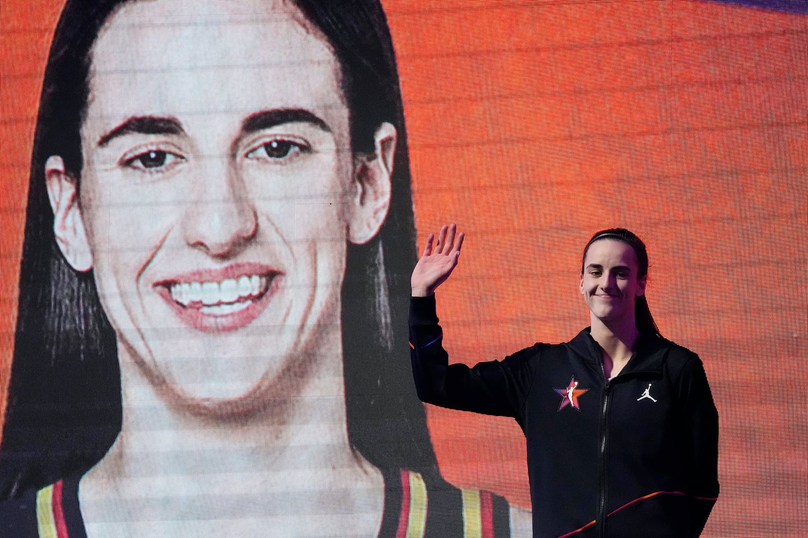 FILE- Indiana Fever's Caitlin Clark, of Team WNBA, is introduced prior to a WNBA All-Star basketball game against Team USA, Saturday, July 20, 2024, in Phoenix. (AP Photo/Ross D. Franklin, File)