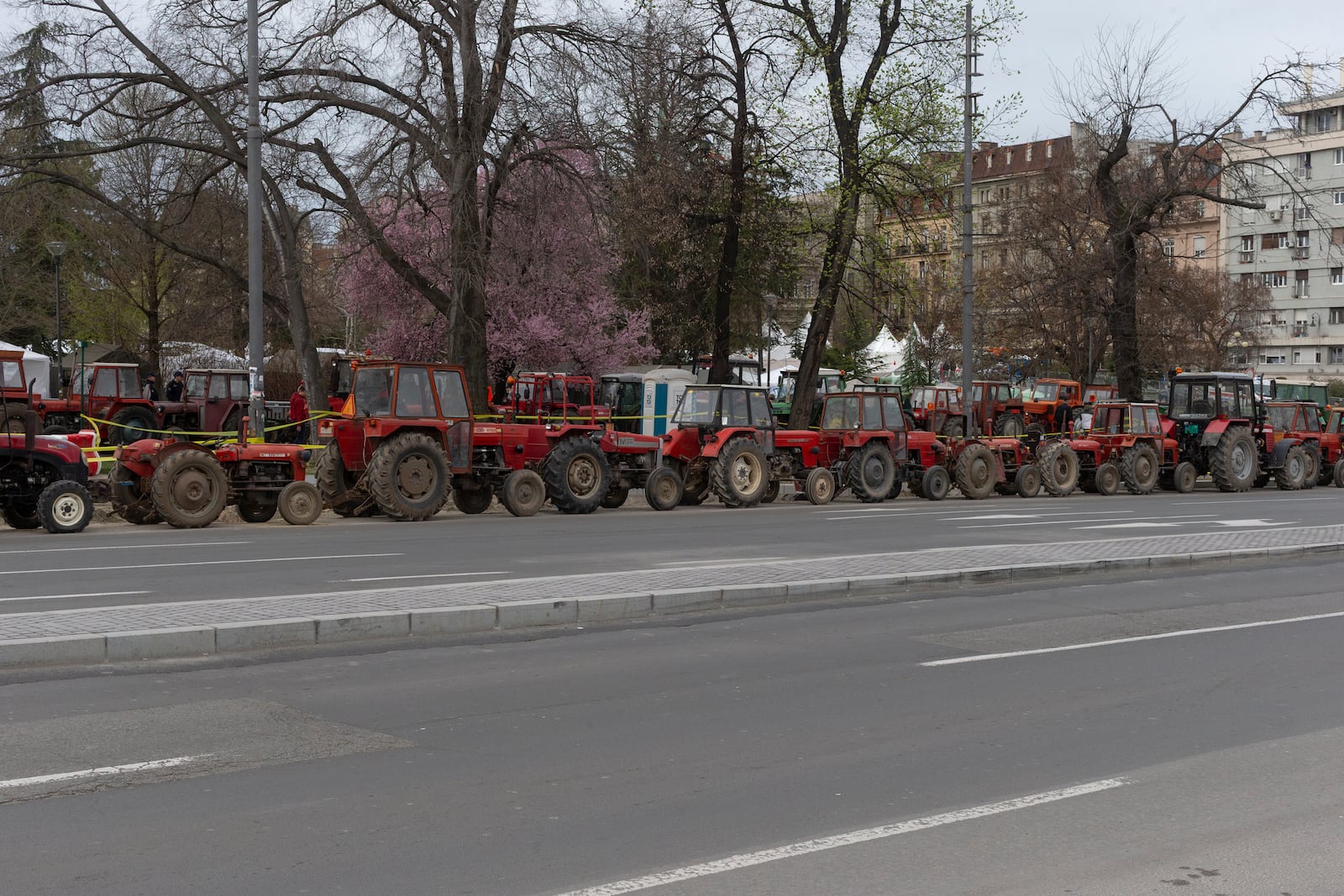 Tractors brought by supporters of the Serbian president Aleksandar Vucic are parked on the side of the street in Belgrade, Serbia, Friday, March 14, 2025, as the country prepares for a major anti-corruption rally this weekend. (AP Photo/Marko Drobnjakovic)