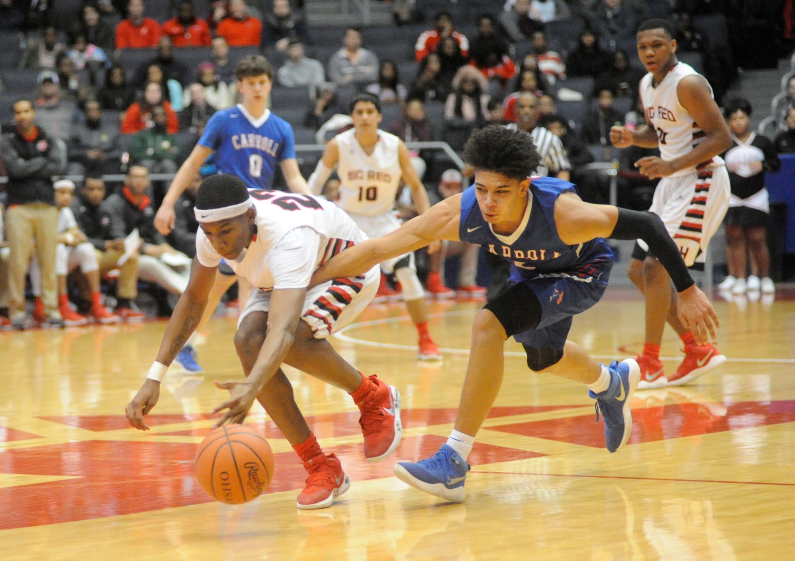 Carroll’s Eli Ramsey (right) vs. Cin. Hughes at UD Arena, March 8, 2018. MARC PENDLETON / STAFF