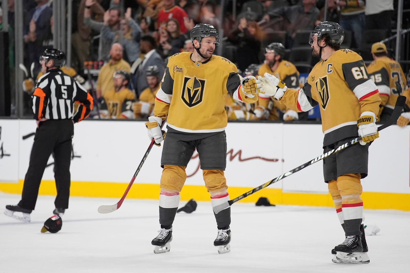 Vegas Golden Knights center Tomas Hertl, center, celebrates after his third goal of the game from an assist by Vegas Golden Knights right wing Mark Stone (61) against the Los Angeles Kings during the third period of an NHL hockey game Sunday, March 9, 2025, in Las Vegas. (AP Photo/John Locher)