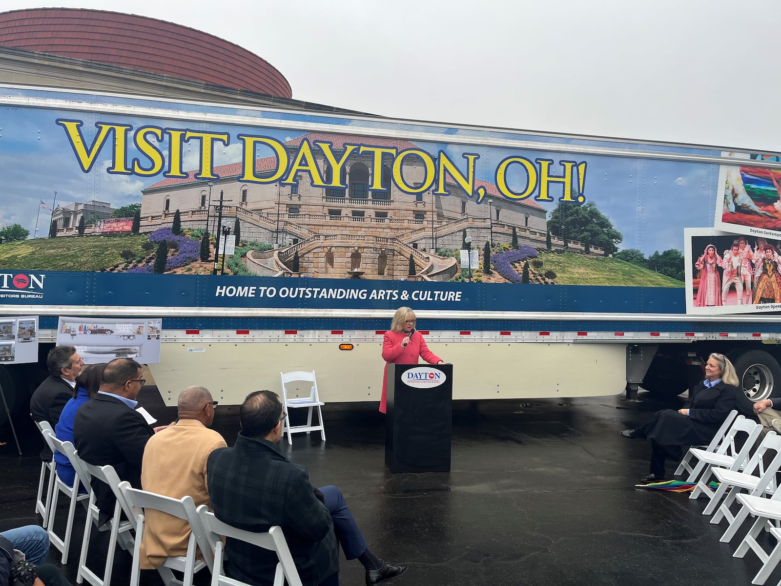 Jacquelyn Powell, president and CEO of the Dayton Convention & Visitors Bureau, talks about a new traveling billboard, which is a semi-trailer with images promoting Dayton that will crisscross the nation. CORNELIUS FROLIK / STAFF