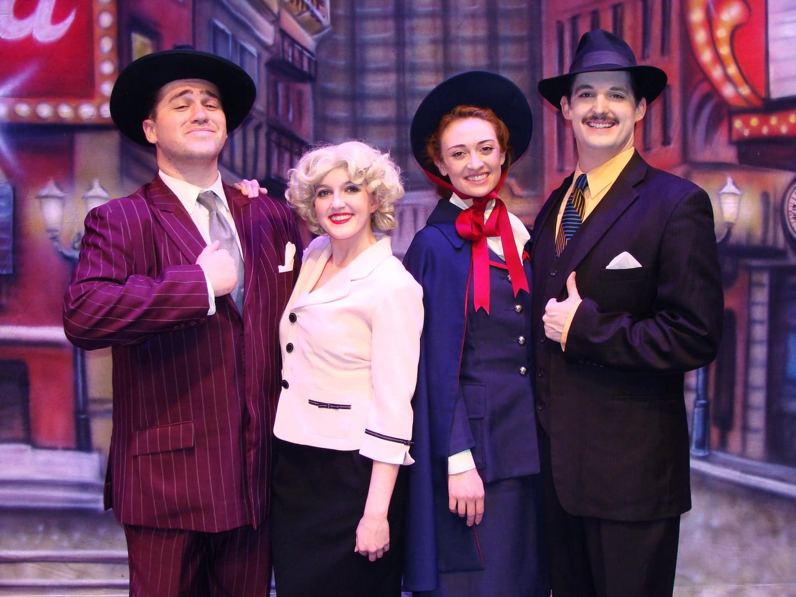 Left to right: Cole Fletcher (Nathan Detroit), Allison Gabert (Adelaide), Emily Brennan (Sarah Brown) and Elliot Handkins (Sky Masterson) in La Comedia Dinner Theatre's production of "Guys and Dolls." PHOTO BY JUSTIN WALTON