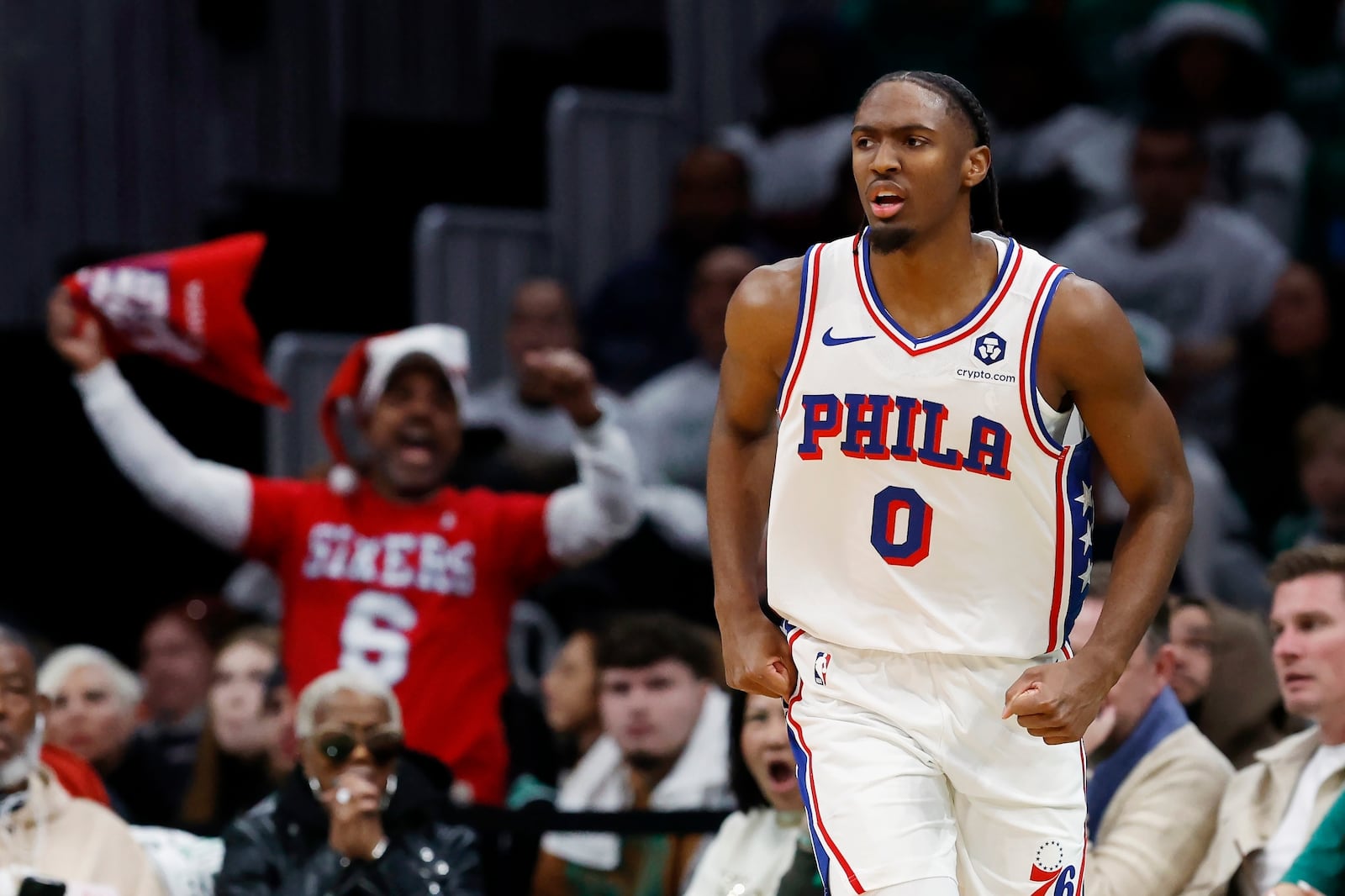 Philadelphia 76ers' Tyrese Maxeyn (0) celebrates his three-pointer against the Boston Celtics during the first half of an NBA basketball game, Wednesday, Dec. 25, 2024, in Boston (AP Photo/Michael Dwyer)