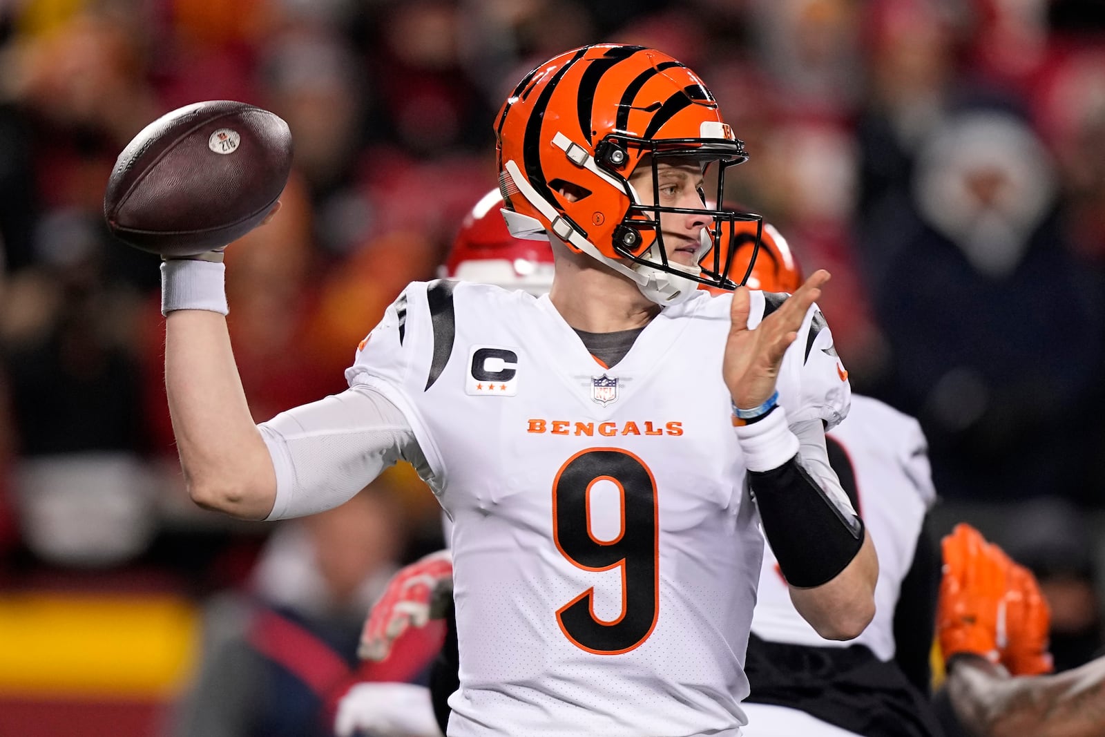 Cincinnati Bengals quarterback Joe Burrow (9) works in the pocket against the Kansas City Chiefs during the first half of the NFL AFC Championship playoff football game, Sunday, Jan. 29, 2023, in Kansas City, Mo. (AP Photo/Brynn Anderson)