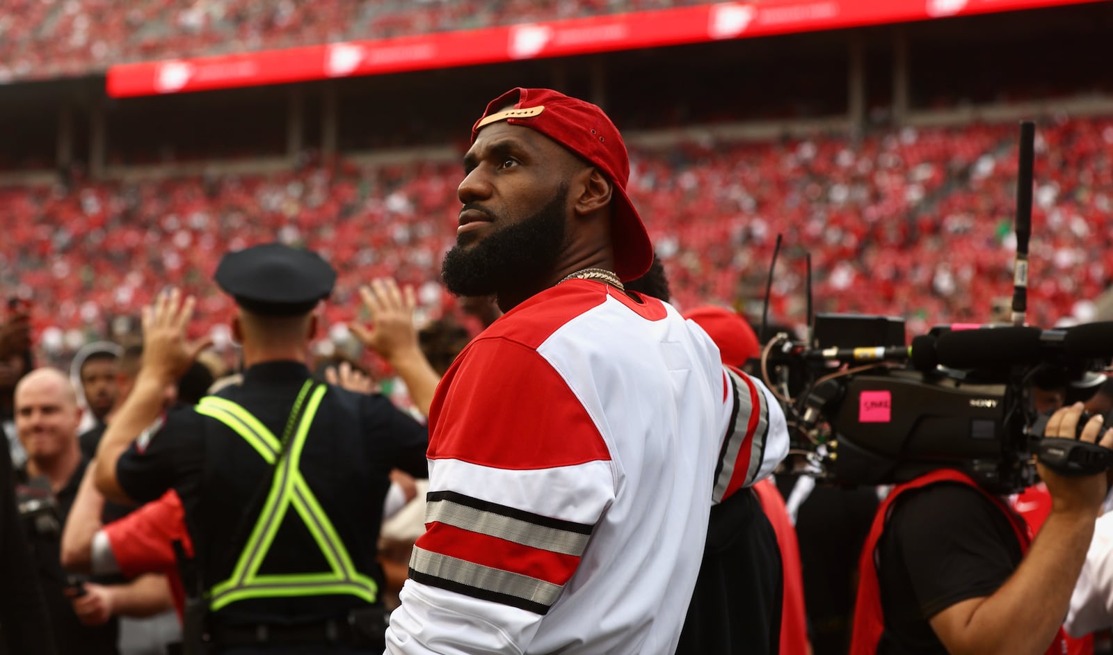 LeBron James puts his arm around his son, Bronny, before a game between Ohio State and Notre Dame on Saturday, Sept. 3, 2022, at Ohio Stadium in Columbus. David Jablonski/Staff