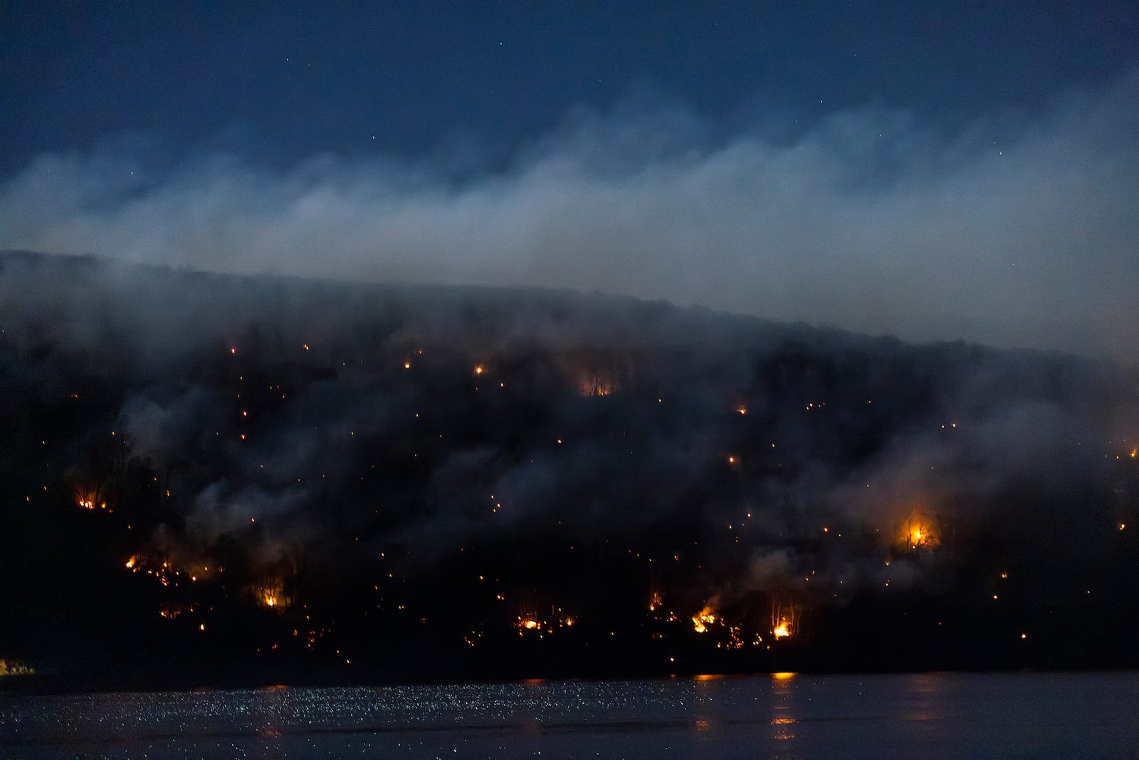 Wildfires burn along the New York and New Jersey border in Greenwood Lake, New York, Wednesday, Nov. 13, 2024. (AP Photo/Eduardo Munoz Alvarez)