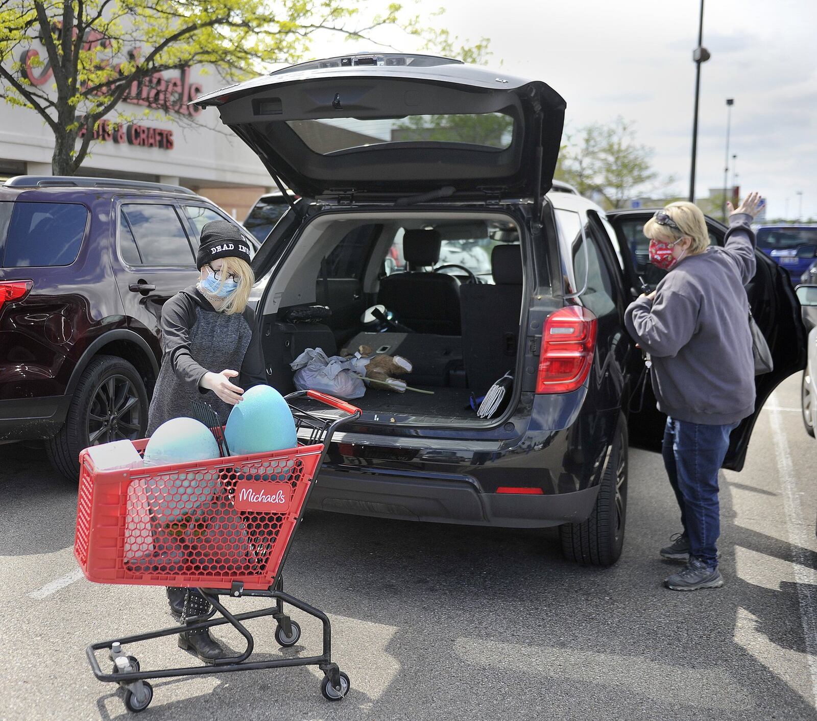 Mother and daughter, Krista and Kortney Esposito, take their first leisure shopping trip at Michael s craft store in Beavercreek since the start of the coronavirus pandemic as many retailers open back up Tuesday. MARSHALL GORBYSTAFF