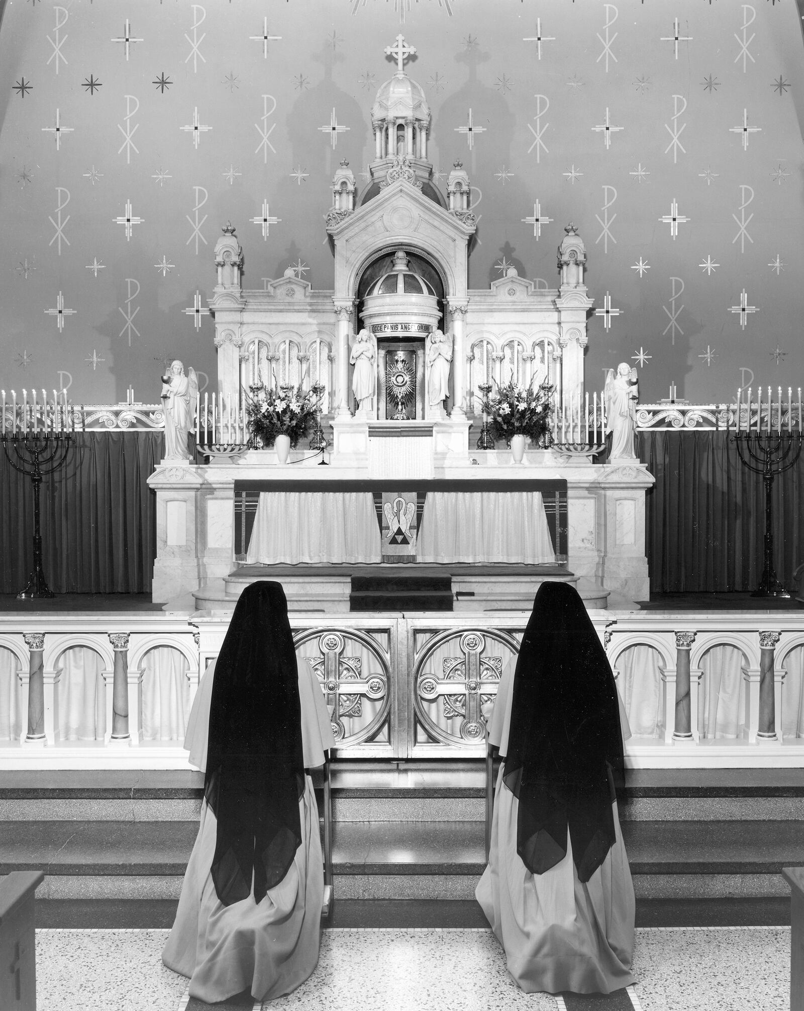 Two Sisters of the Precious Blood in adoration before the Blessed Sacrament in the Motherhouse chapel in Dayton, Ohio, ca. 1955. Photo courtesy of CPPS Archives, Sisters of the Precious Blood, Dayton, Ohio.