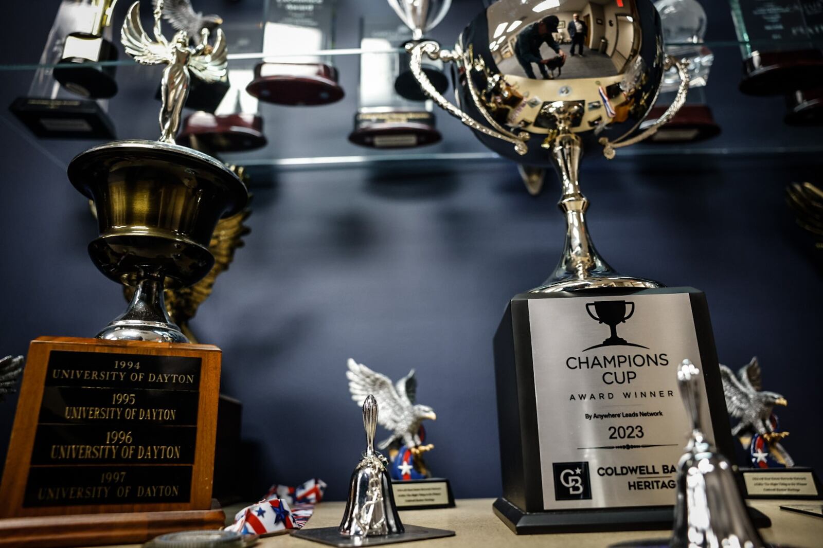 Coldwell Banker Heritage in Beavercreek displays numerous trophies in its awards case. The firm, which got its start as Heritage Realtors in 1967, is the Number One relator in the Dayton area market for volume of real estate sales for the 50th consecutive year. JIM NOELKER/STAFF