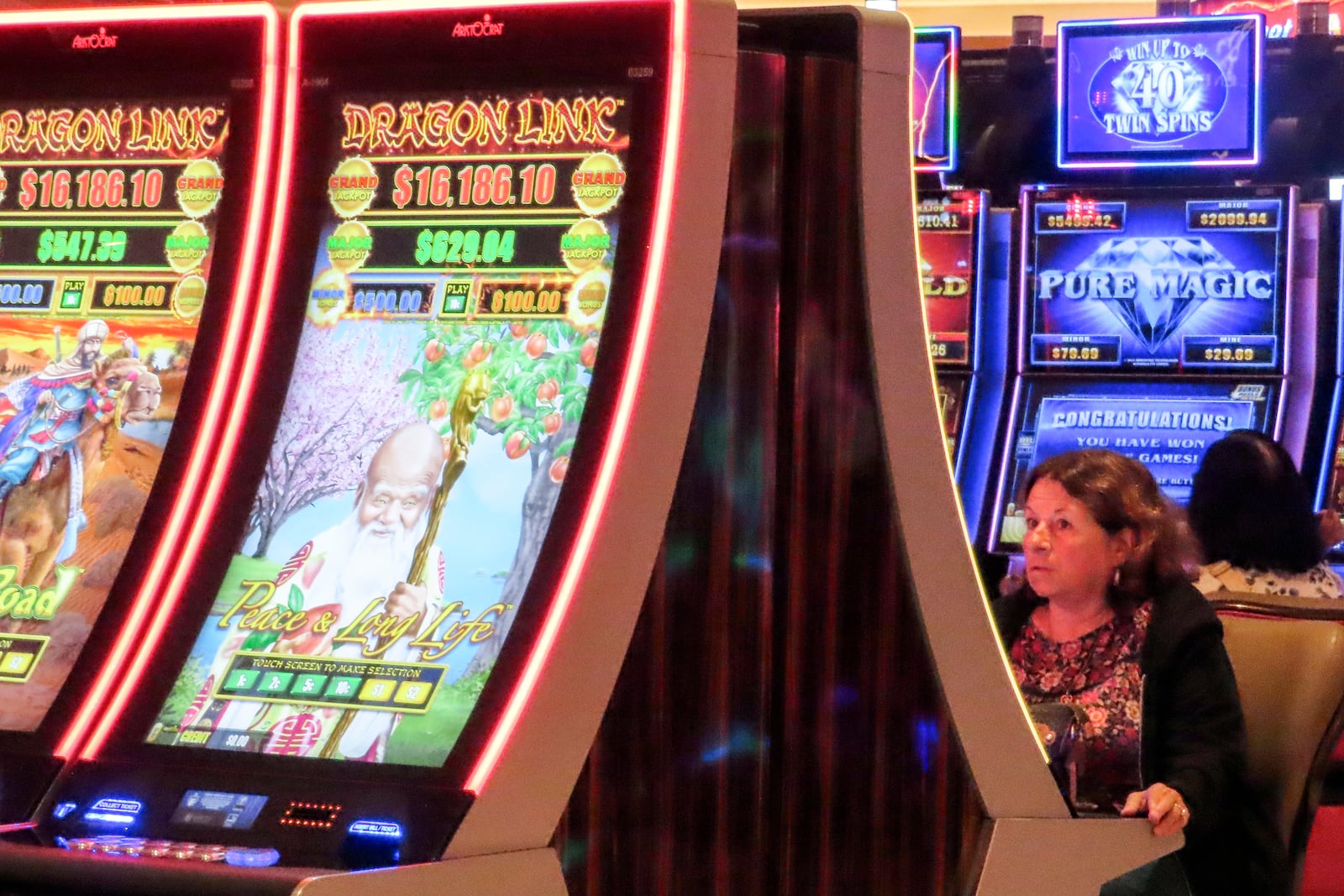 A gambler plays a slot machine at the Hard Rock casino in Atlantic City, N.J., Thursday, Oct. 3, 2024. (AP Photo/Wayne Parry)