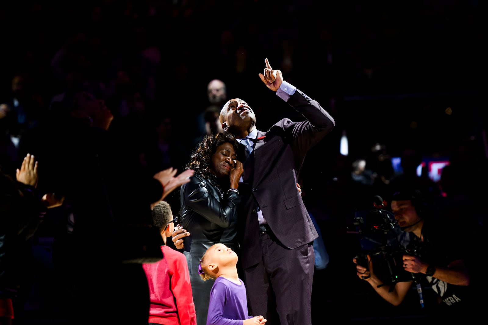 Former Toronto Raptors player Vince Carter reacts while hugging his mother, Michelle Carter, during his number retirement ceremony at halftime of an NBA basketball game between the Toronto Raptors and the Sacramento Kings in Toronto on Saturday, Nov. 2, 2024. (Christopher Katsarov/The Canadian Press via AP)