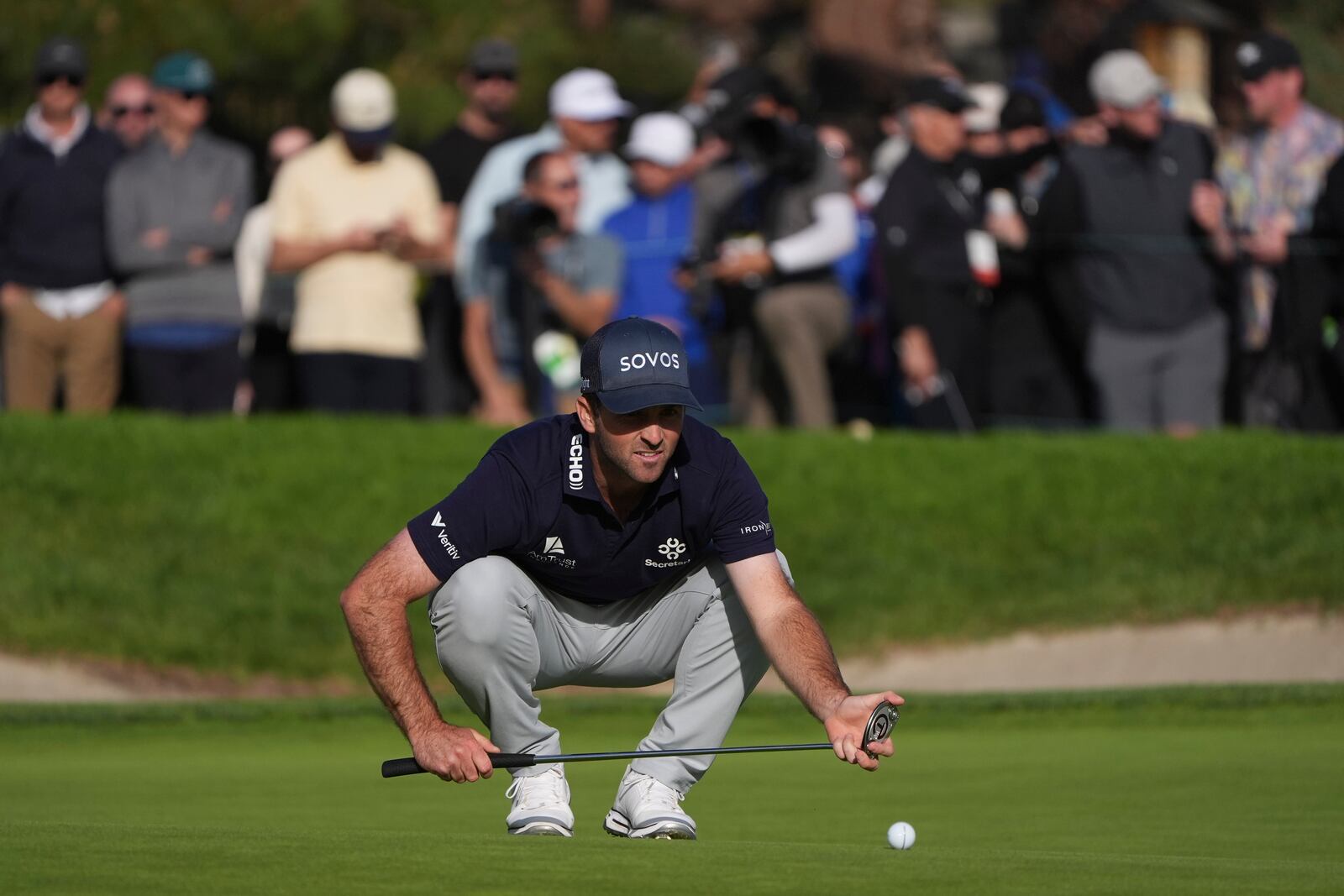 Denny McCarthy lines up a putt on the 18th green of the South Course at Torrey Pines during the third round of the Genesis Invitational golf tournament Saturday, Feb. 15, 2025, in San Diego. (AP Photo/Gregory Bull)