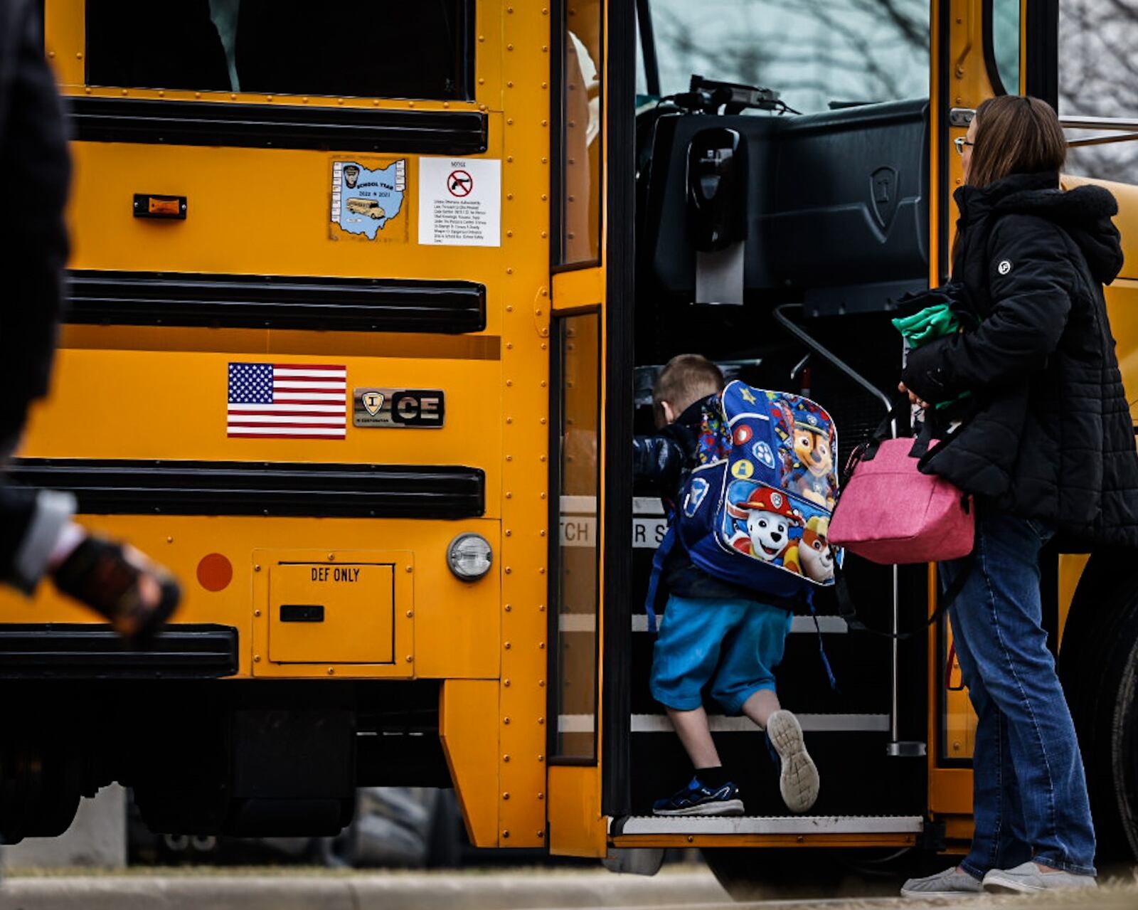 Students at Wright Brothers Elementary head to the bus for a ride home Tuesday December 13, 2022. Schools across the region are still struggling to cover bus routes including Huber Heights schools. JIM NOELKER/STAFF