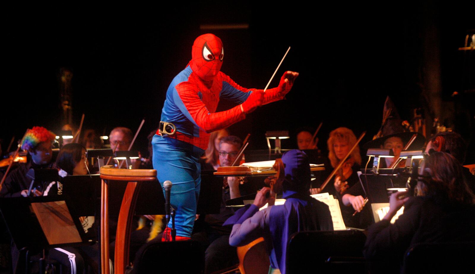 Dressed as Spiderman, Neal Gittleman conducts the Dayton Philharmonic's annual PhilharMonster Concert Saturday, Oct. 30, at the Schuster Center.