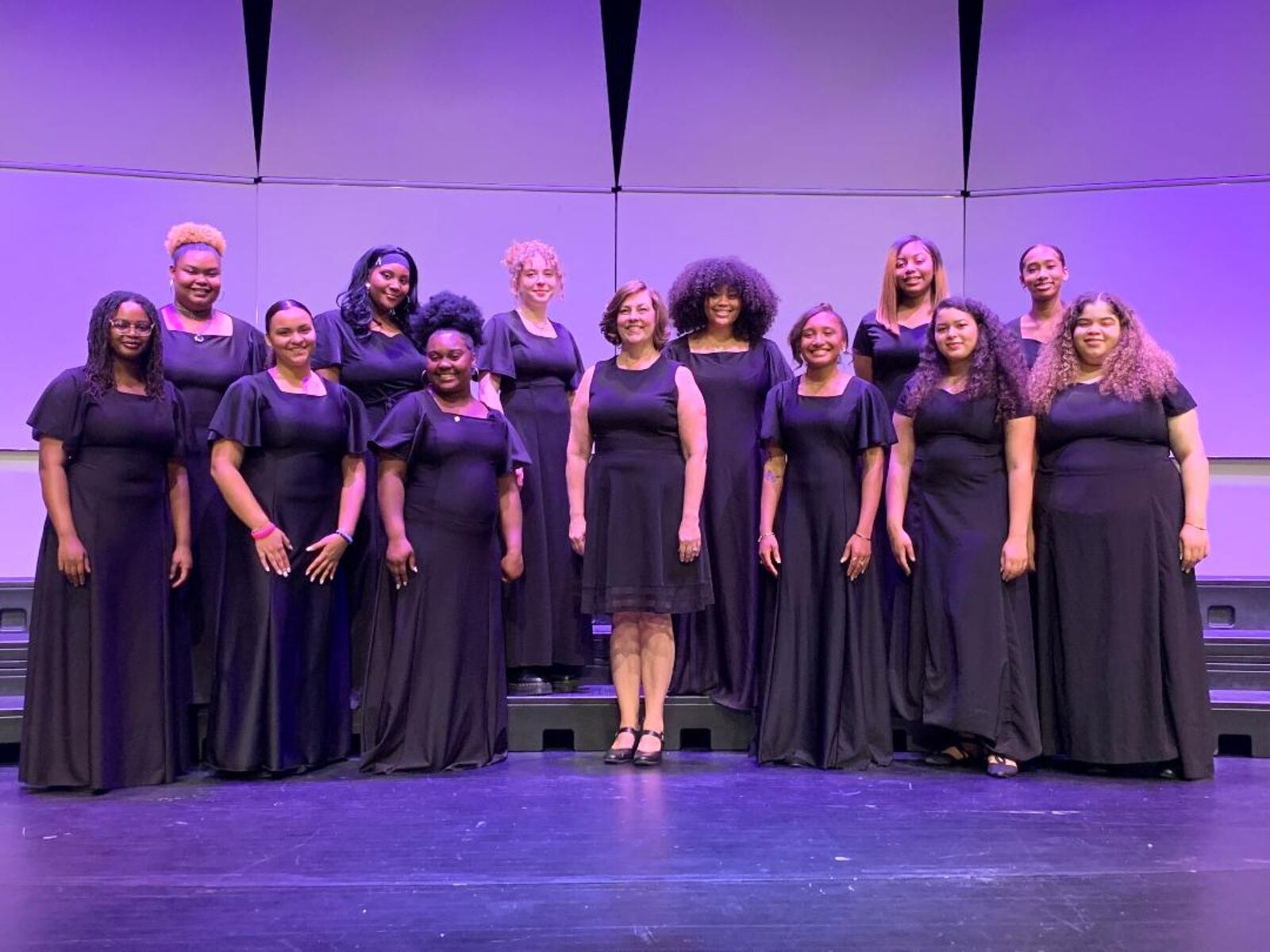 Director Paula Powell (center) and the Stivers Chorale pose for a photo in spring 2022. CONTRIBUTED