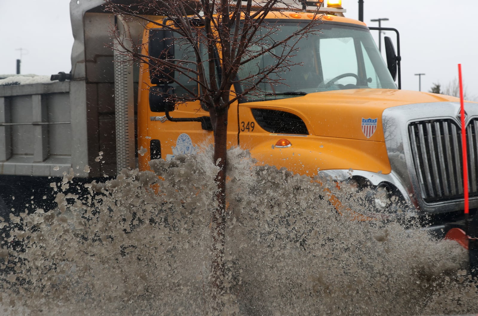 A City of Springfield snow plow cleans snow and slush off Columbia Avenue in this file photo. BILL LACKEY/STAFF