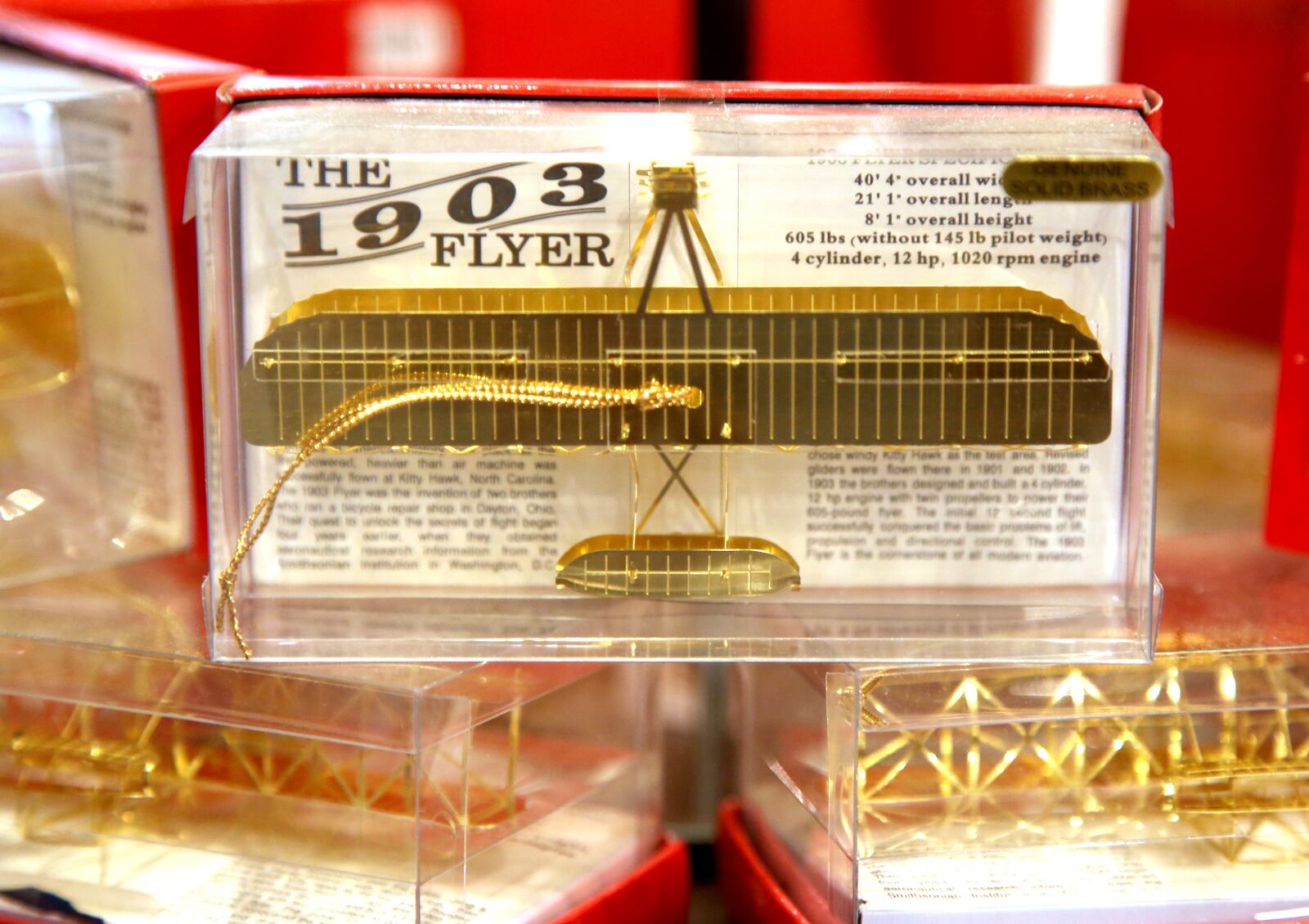 The Carillon Historical Park museum store specializes in all things Dayton. A brass ornament of the 1903 Wright Flyer is $17.  LISA POWELL / STAFF