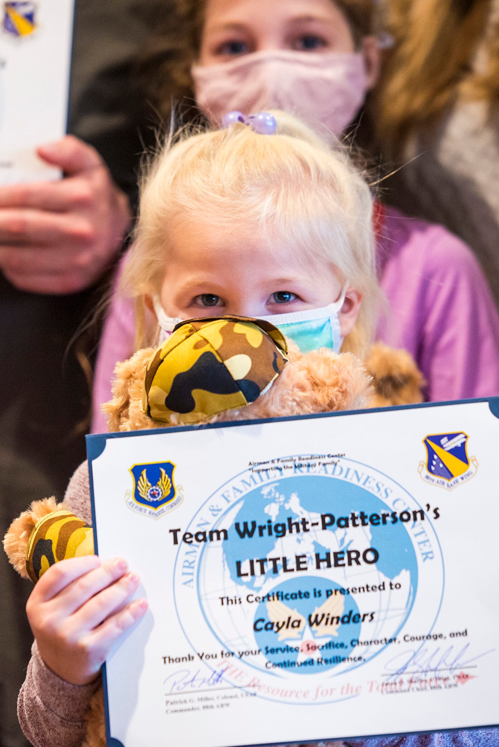 During the "Little Heroes" event, 38 children were each presented with a certificate of appreciation, stuffed bear and medal for their service and sacrifice in support of their deployed parent. U.S. AIR FORCE PHOTO/JAIMA FOGG