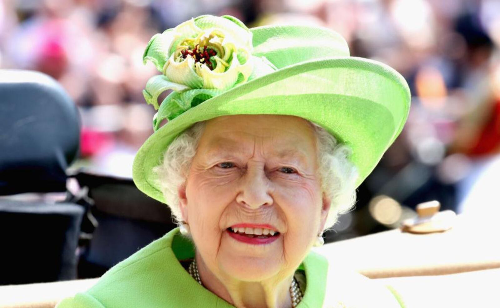 Queen Elizabeth II arrives at the parade ring with the Royal Procession during Royal Ascot 2017 at Ascot Racecourse on June 20, 2017 in Ascot, England, wearing a bright and bold green hat.