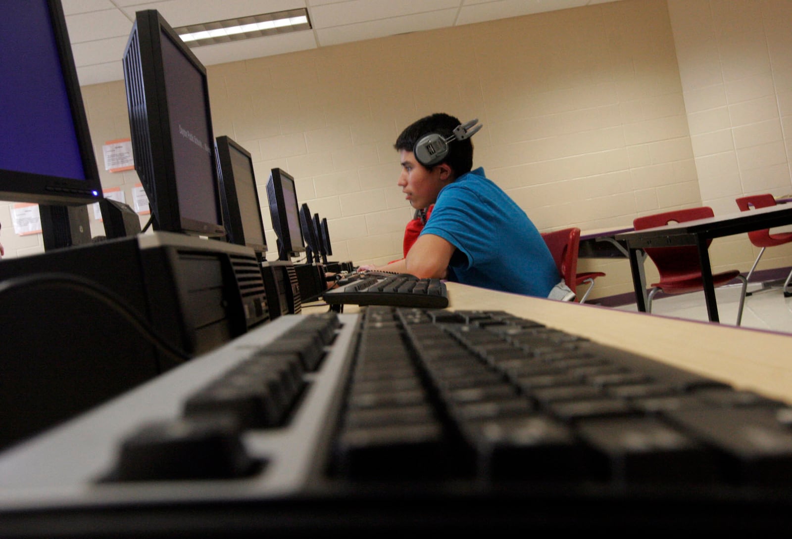 Phillip Campos, an eighth-grade student at Eastmont PreK-8 School in Dayton, uses a computer in the school’s technology learning center in 2011.