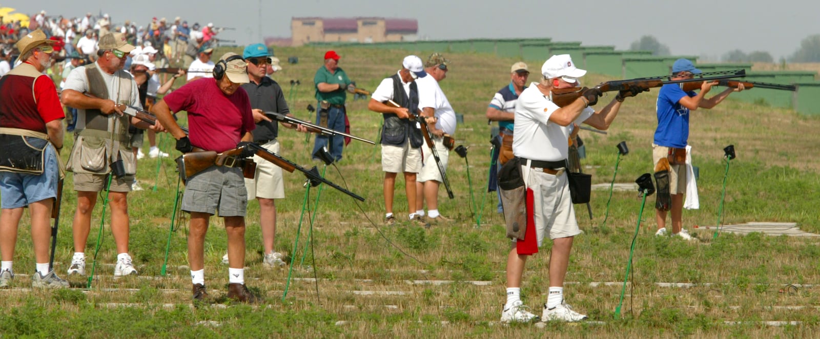 The Grand American Trapshoot has moved from Vandalia to the World Shooting and Recreational Complex about 2 miles north of Sparta, Illinois. The new Events Center building looms up in the background while the shooters take aim.  STAFF PHOTO BY BILL REINKE.