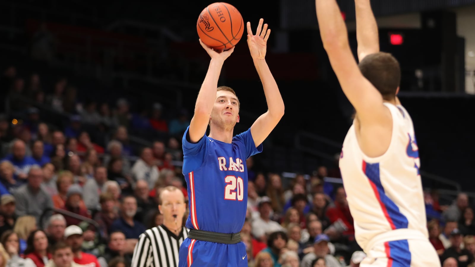 Greeneview High School senior Ben Myers shoots the ball over Tri-Village senior Camden Cook during their Division III district final game on Friday night at UD Arena. The Patriots won 60-50. CONTRIBUTED PHOTO BY MICHAEL COOPER