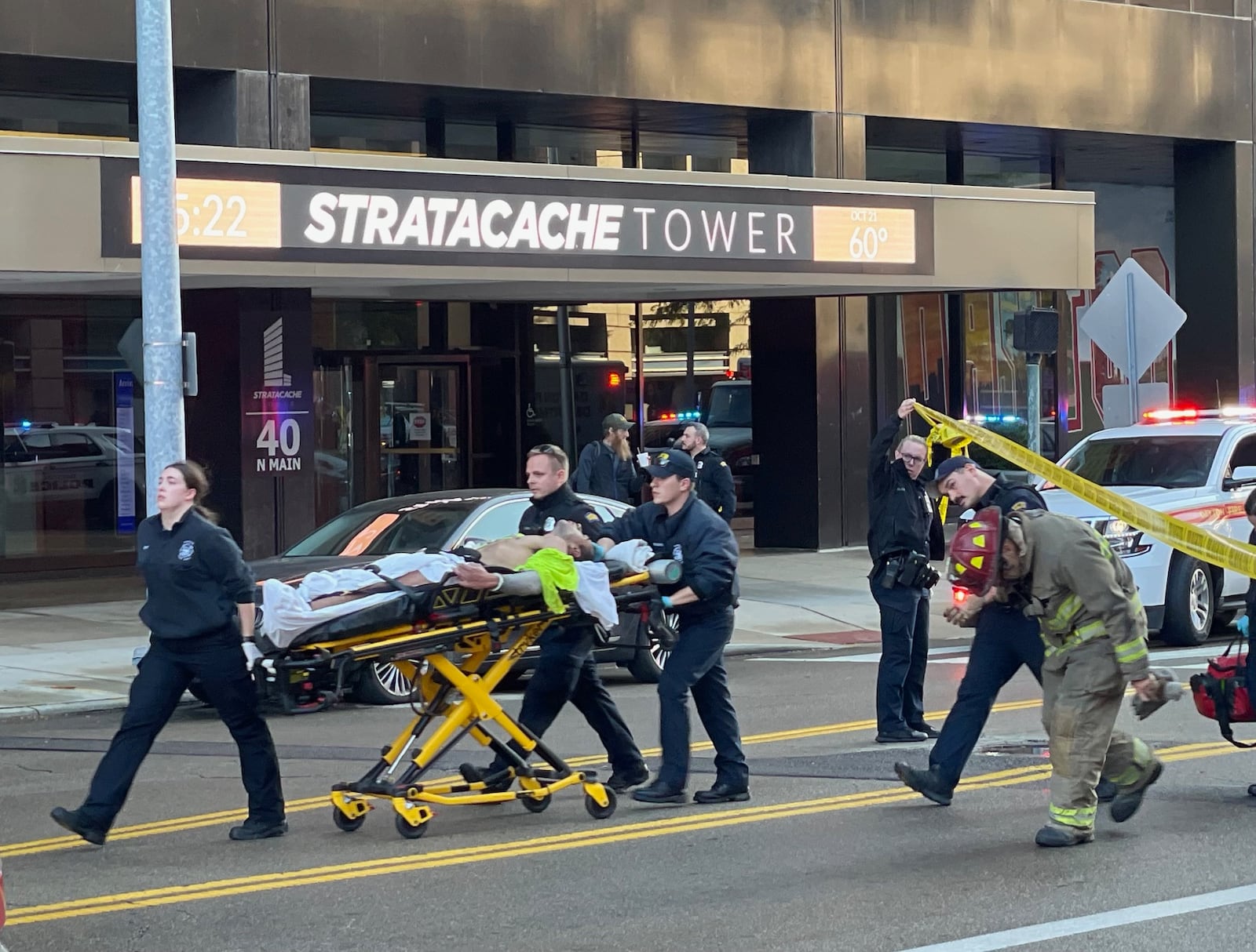 Three people were injured after Dayton firefighters responded to a fire alarm around 5 p.m. Saturday at the Premier Health building in the 100 block of North Main Street. One man was arrested after reportedly attacking a security officer and responding fire crews. PHOTO COURTESY LARRY PRICE