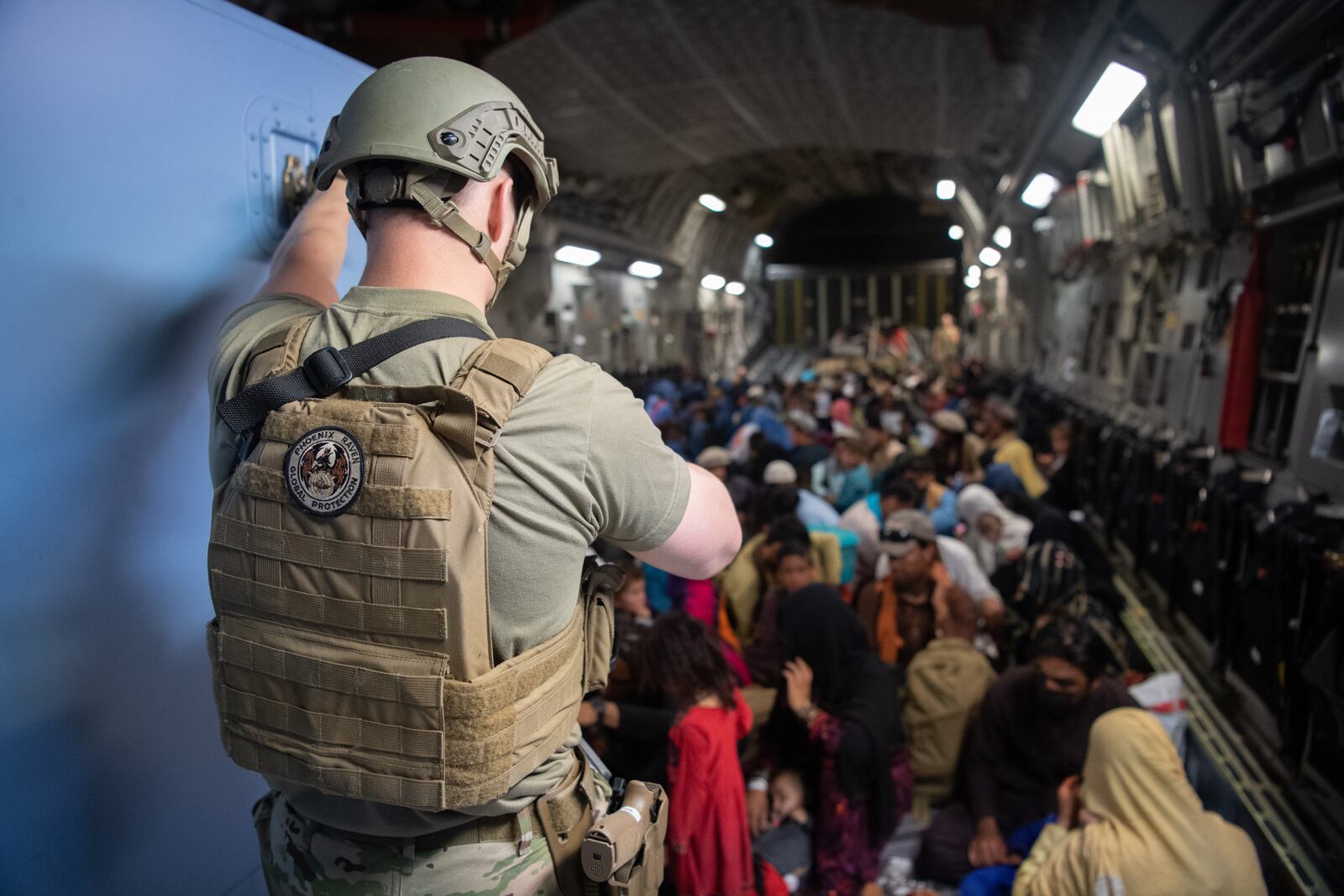 A U.S. Air Force security forces raven, assigned to the 816th Expeditionary Airlift Squadron, maintains security aboard a U.S. Air Force C-17 Globemaster III aircraft in support of the Afghanistan evacuation at Hamid Karzai International Airport (HKIA), Afghanistan, Aug. 24, 2021. (U.S. Air Force photo by Master Sgt. Donald R. Allen)