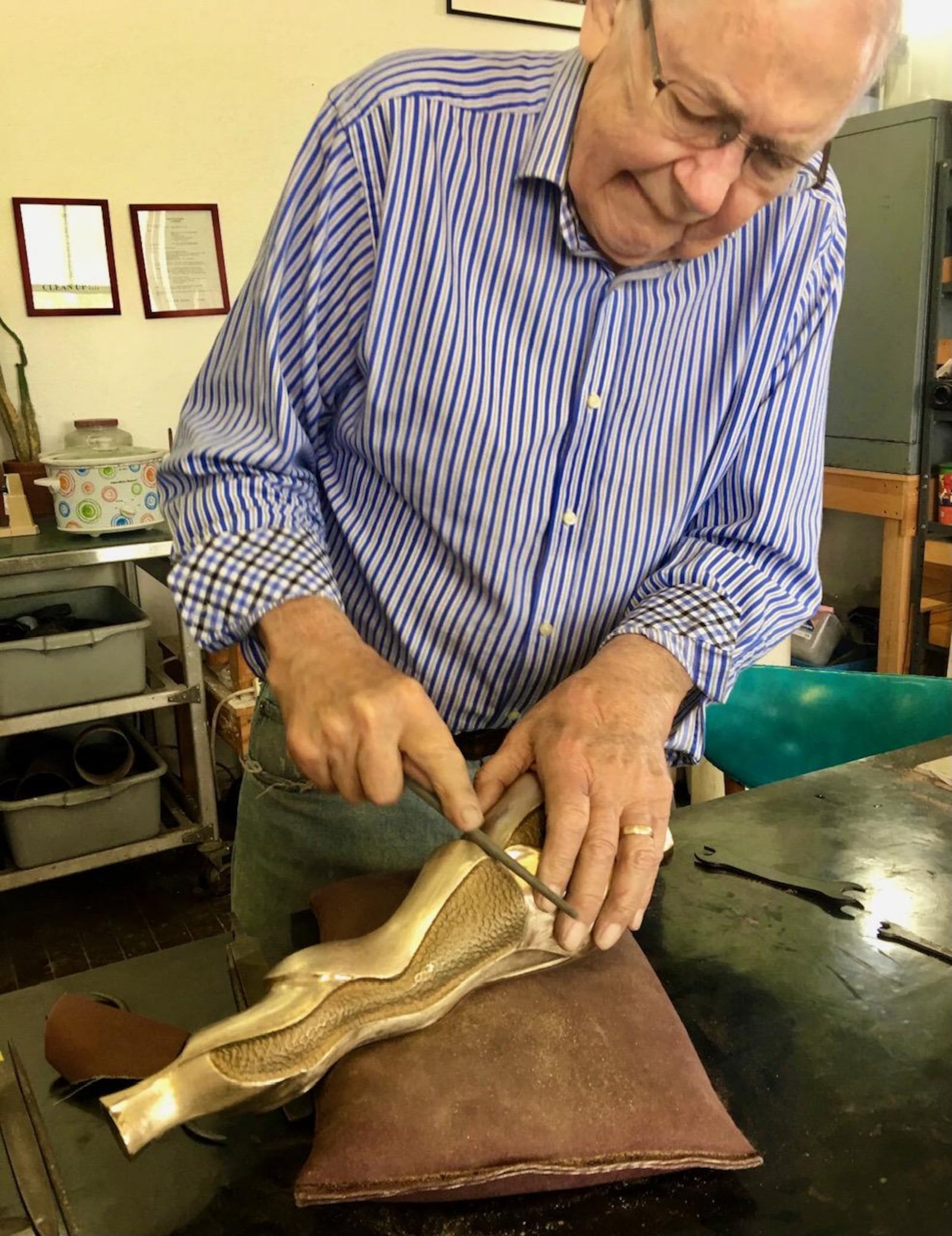 David Brand working on his bronze sculpture, "Fancy Lady." CONTRIBUTED