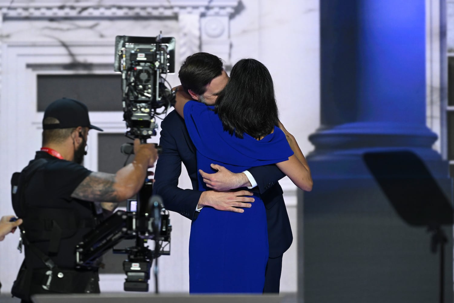 
                        Usha Vance embraces her husband, Sen. JD Vance (R-Ohio), the Republican vice presidential nominee, after speaking on the third night of the Republican National Convention at the Fiserv Forum in Milwaukee, on Wednesday, July 17, 2024. (Kenny Holston/The New York Times)
                      