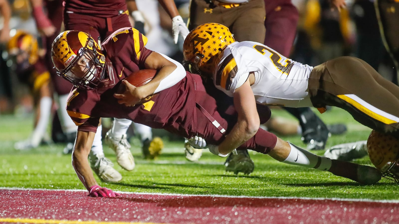 Ross quarterback C.J. Boze scores one of his three touchdowns against Alter in the Division III, Region 12 finals on Friday, Nov. 6, 2020. Michael Cooper/CONTRIBUTED