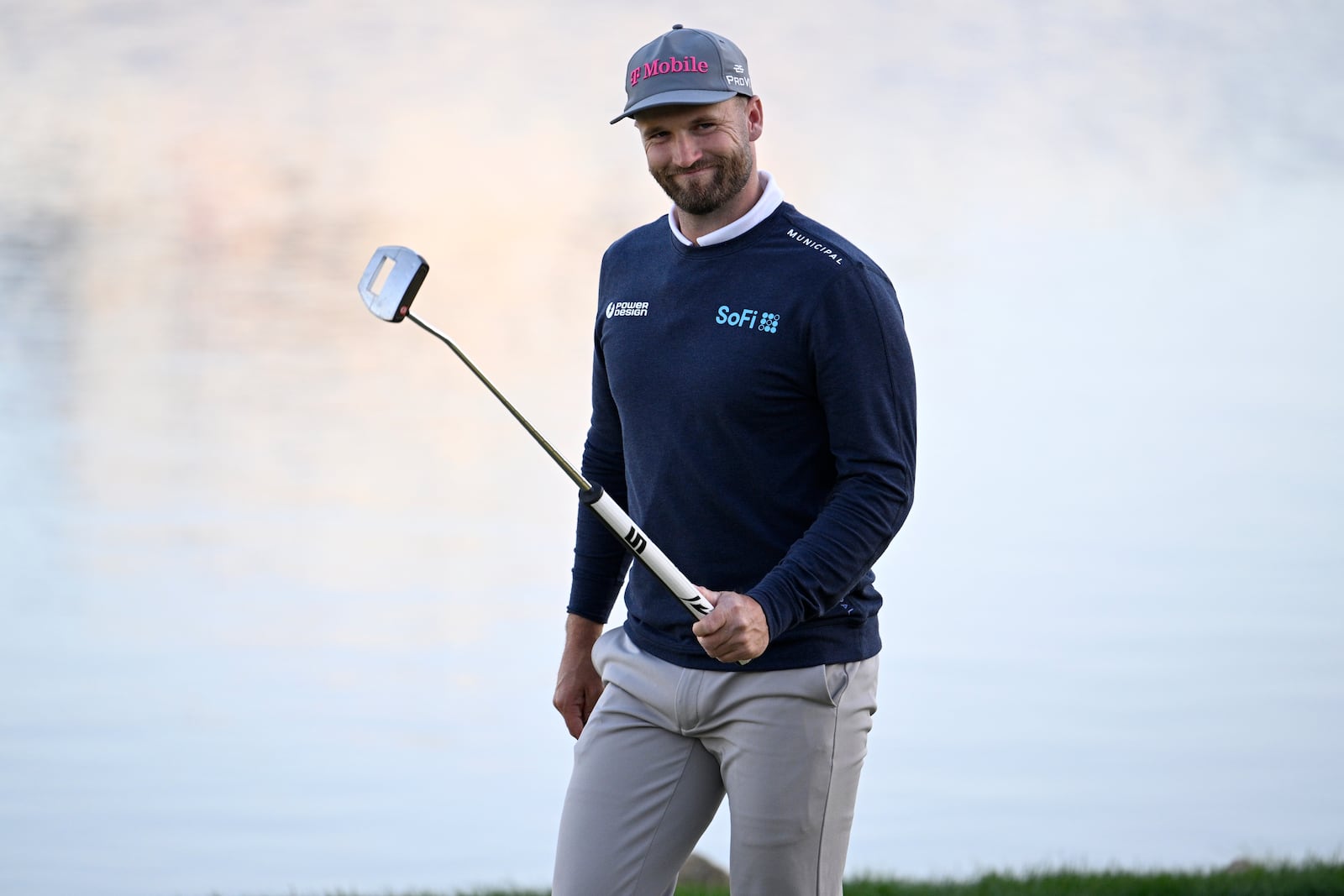 Wyndham Clark acknowledges the crowd while walking on the 18th green during the first round of the Arnold Palmer Invitational at Bay Hill golf tournament, Thursday, March 6, 2025, in Orlando, Fla. (AP Photo/Phelan M. Ebenhack)