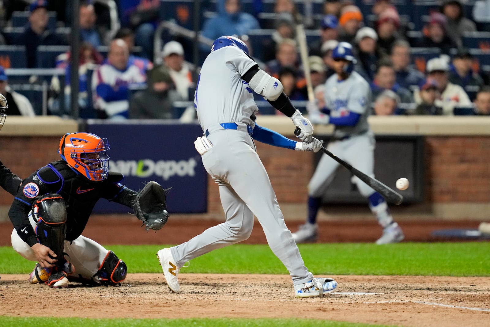 Los Angeles Dodgers' Shohei Ohtani hits a three-run home run against the New York Mets during the eighth inning in Game 3 of a baseball NL Championship Series, Wednesday, Oct. 16, 2024, in New York. (AP Photo/Ashley Landis)