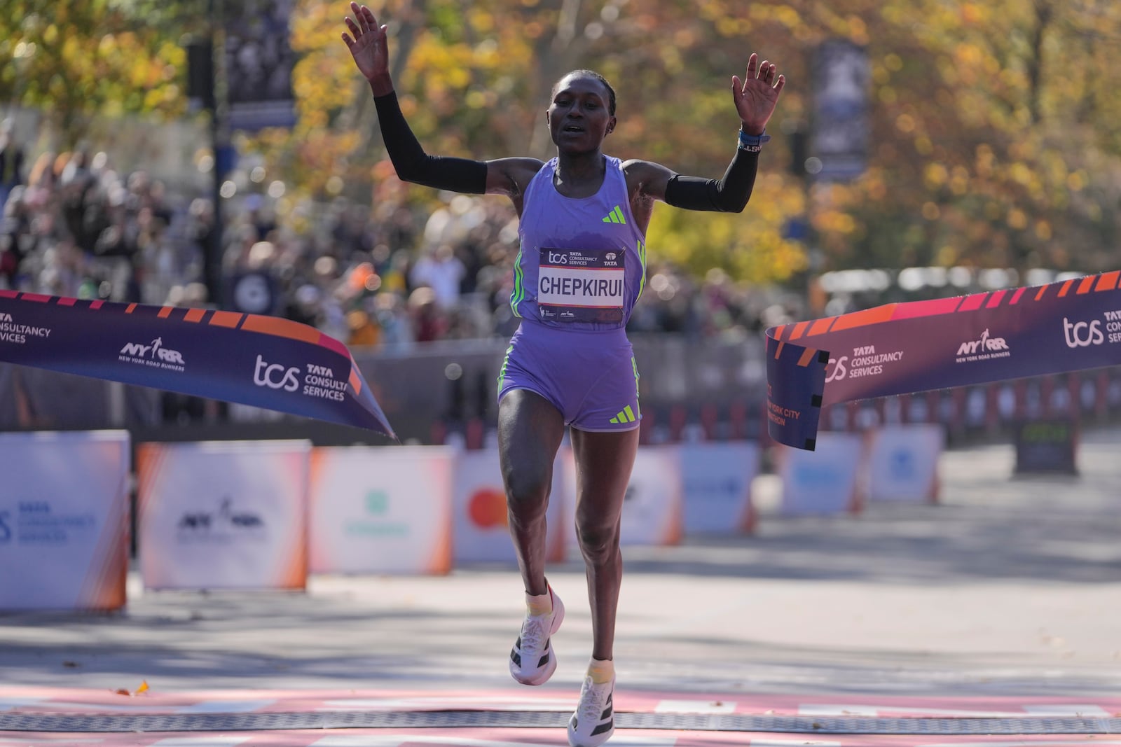 Kenya's Sheila Chepkirui crosses the finish line to win the women's division of the New York City Marathon, Sunday, Nov. 3, 2024, in New York. (AP Photo/Frank Franklin II)