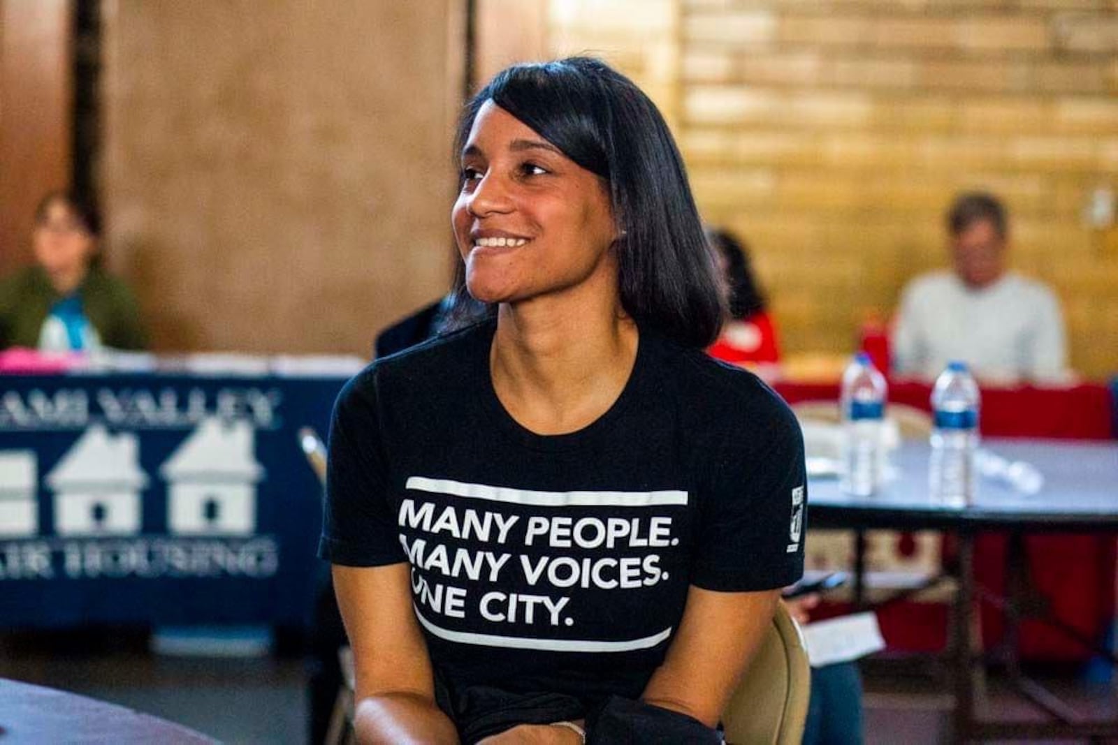 Erica Fields is executive director of Dayton's Human Relations Council. She is in a Many People. Many Voices. One City t-shirt.