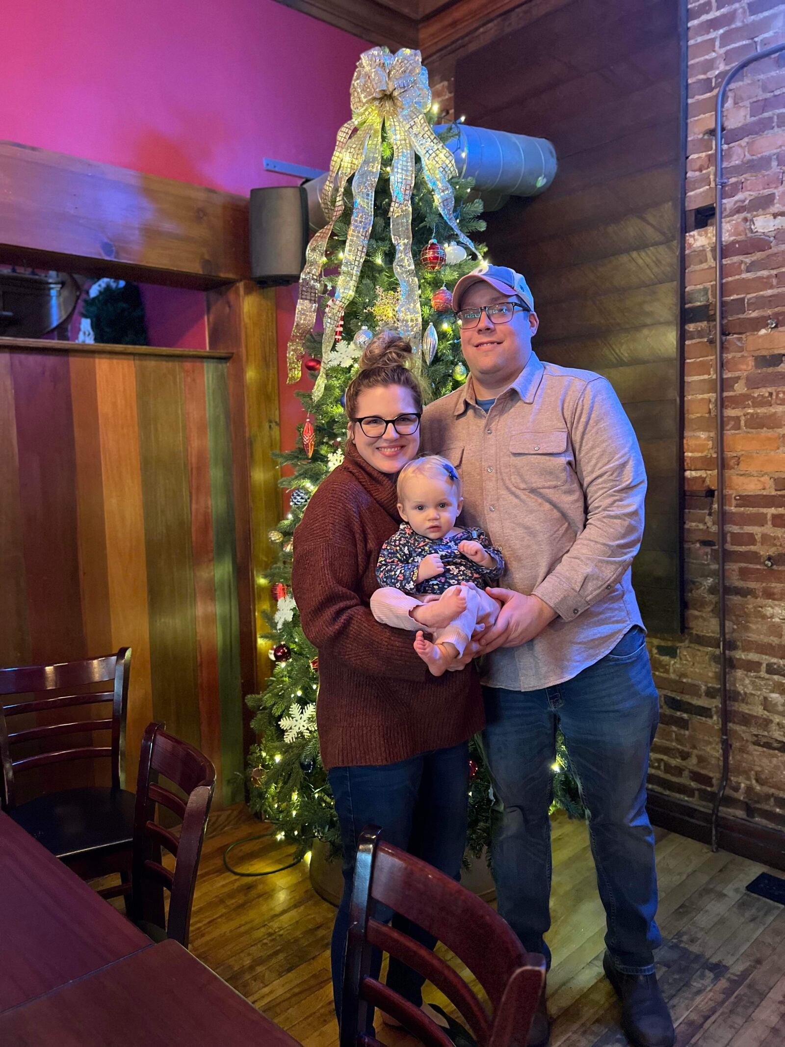 The spaciousness of the Bollins' home makes it ideal for holiday entertaining. The couple and their daughter Laurel are seen in this photo. Contributed