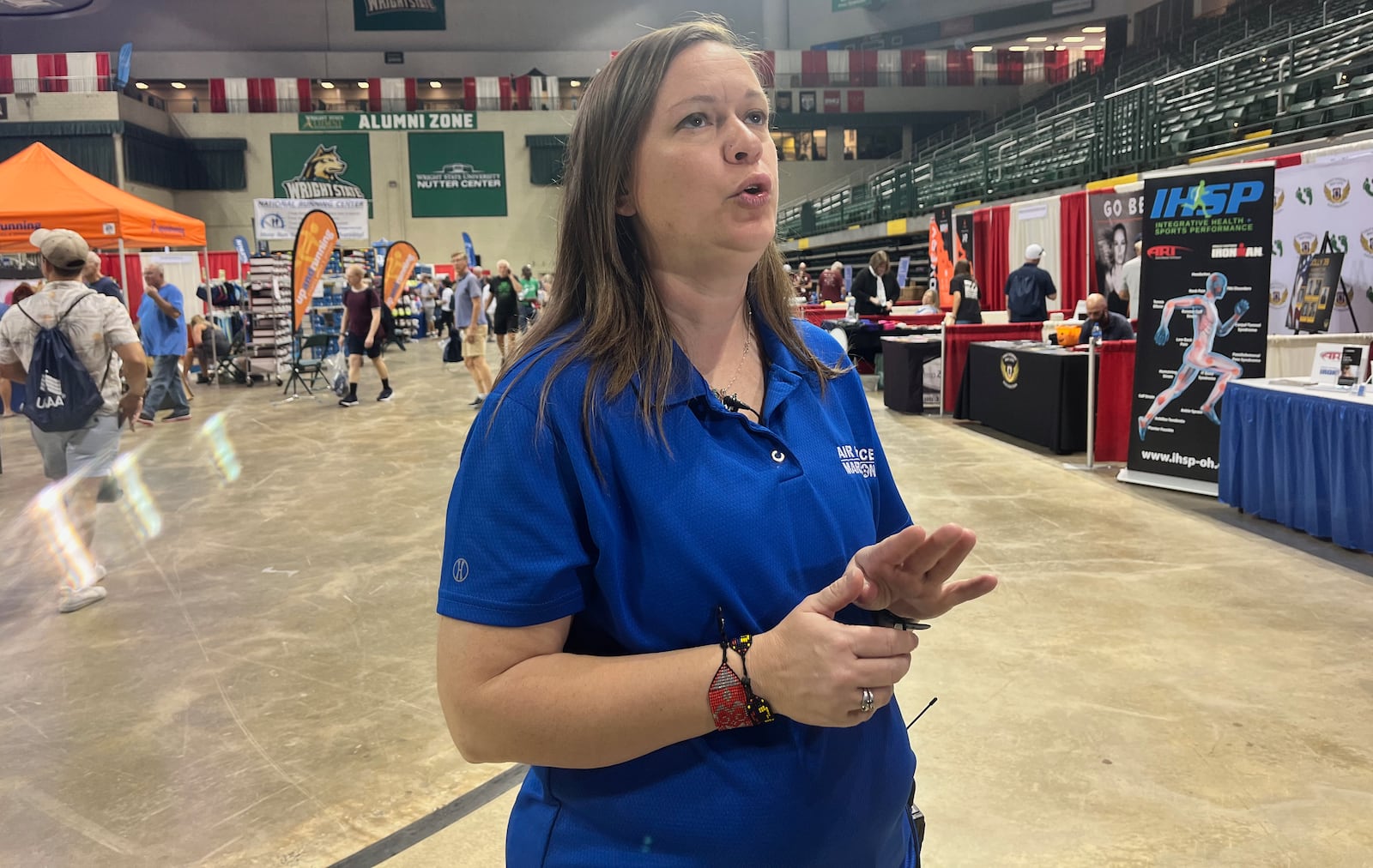 Race director Rachael Ferguson does an interview at the Air Force Marathon Health & Fitness Expo at the Nutter Center on Thursday, Sept. 15, 2022, in Fairborn. David Jablonski/Staff