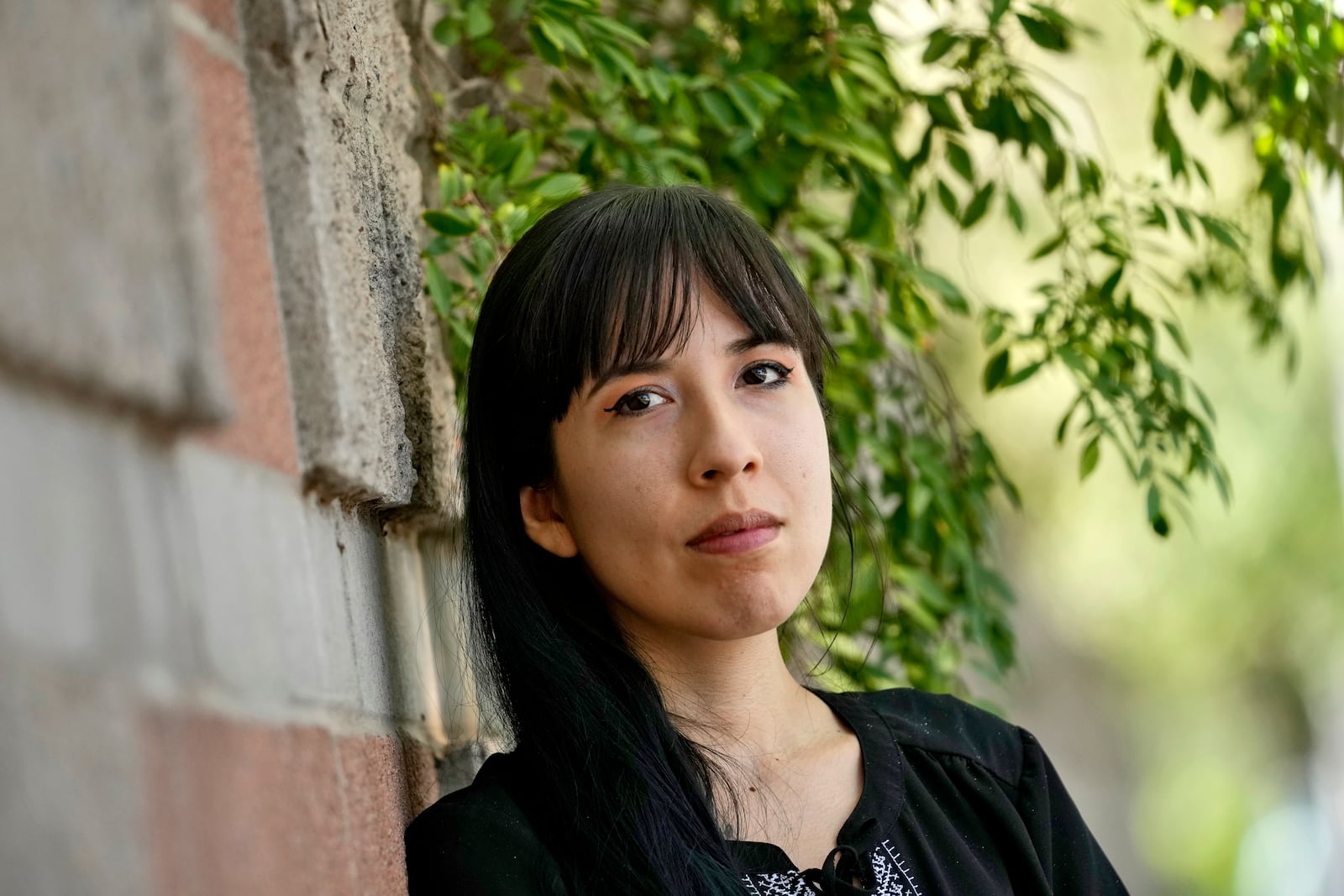 Jocelyn Ruiz, 26, pictured in Tempe, Ariz., Tuesday, Oct. 22, 2024, is a U.S. citizen who discovered a family secret that her mother could be deported at any time. (AP Photo/Matt York)