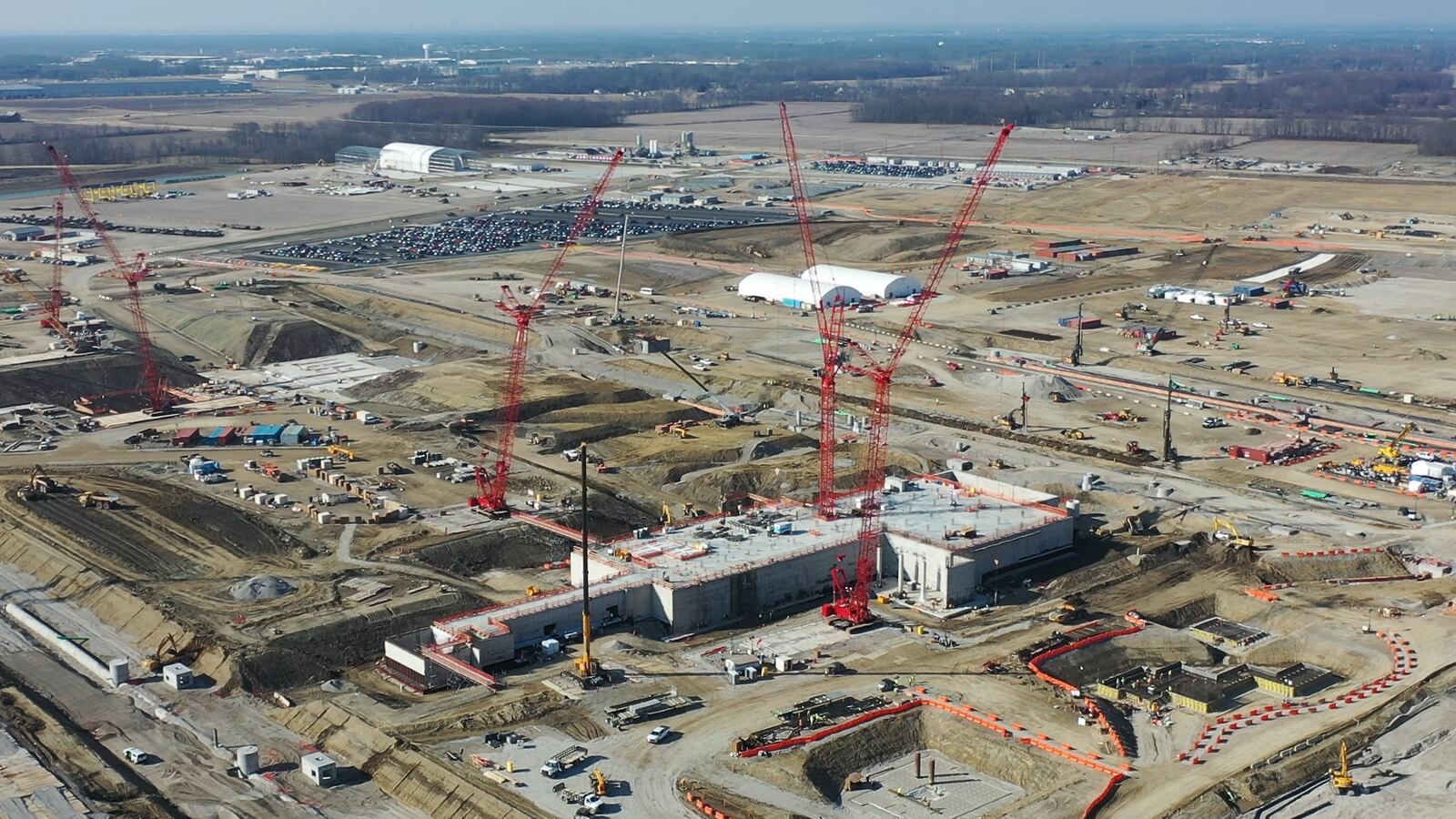 An aerial view from February 2024 shows construction progress at Intel's Ohio One campus in New Albany, Ohio. The company is investing $28 billion to build two semiconductor fabrication plants on the site, which spans nearly 1,000 acres. The company broke ground in September 2022. (Credit: Intel Corporation)