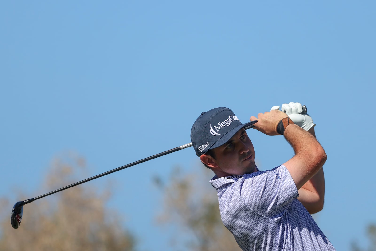 J.T. Poston hits off the tee on the fourth hole during the final round of the Shriners Children's Open golf tournament, Sunday, Oct. 20, 2024, in Las Vegas. (AP Photo/Ian Maule)